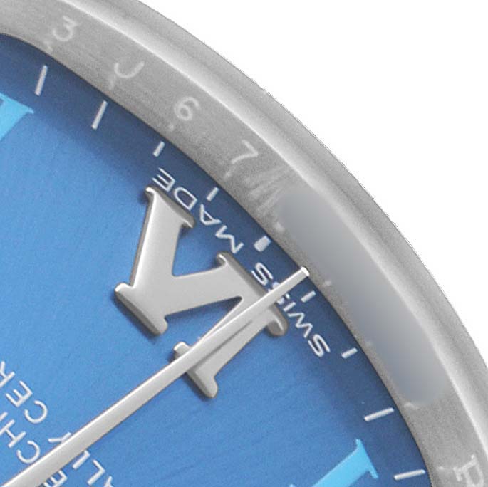 This image shows a close-up of the dial and bezel of a Mid-Size Rolex watch, highlighting numbers and hands.