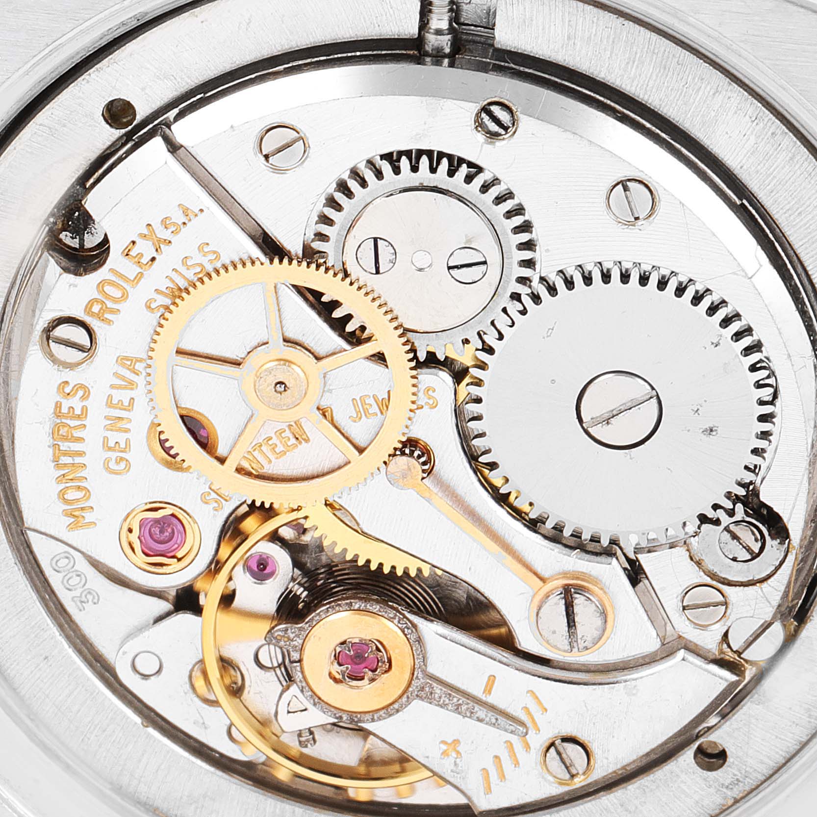 This image shows the intricate internal mechanics and gears of a Vintage Collection Rolex watch from a close-up angle.