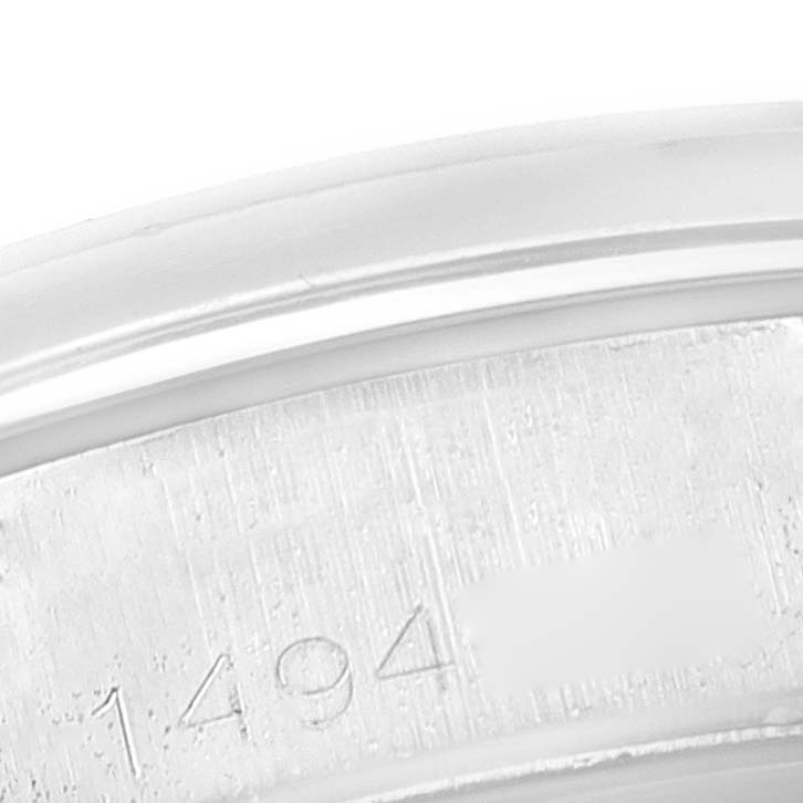 This image shows a close-up of the serial number engraving on the bezel of a Vintage Collection Rolex watch.