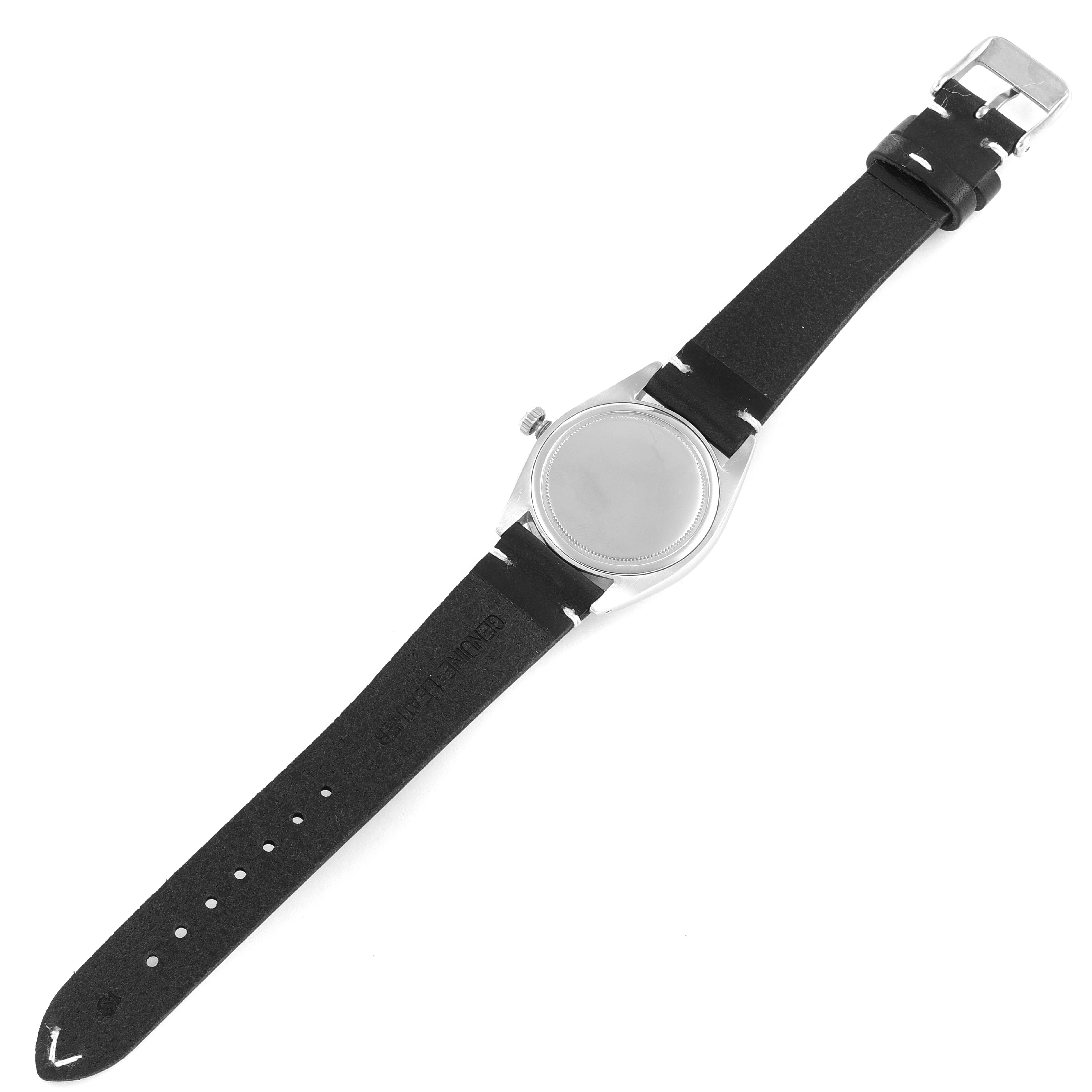 This image shows the back view of a Vintage Collection Rolex watch with a black strap and a closed clasp.