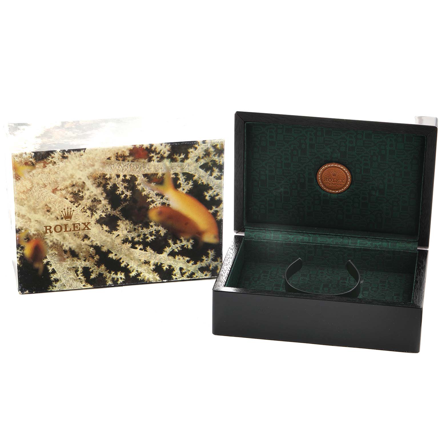 The image shows a Rolex box for the President model, open to display the interior, alongside its decorative outer packaging.