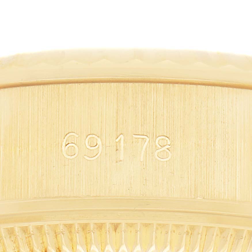 The image shows a close-up of the side of a Rolex Datejust 69178 Women's Yellow Gold Champagne Dial watch case, focusing on the embossed reference number.