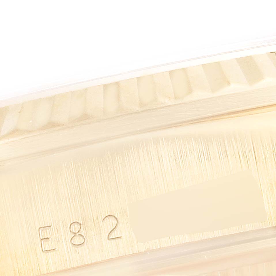 This image shows a close-up of the engraved detail on the side of the bezel and case of a Rolex President 18238 Men
s Yellow Gold Champagne Dial 18238 Men
s Yellow Gold Champagne Dial model watch.