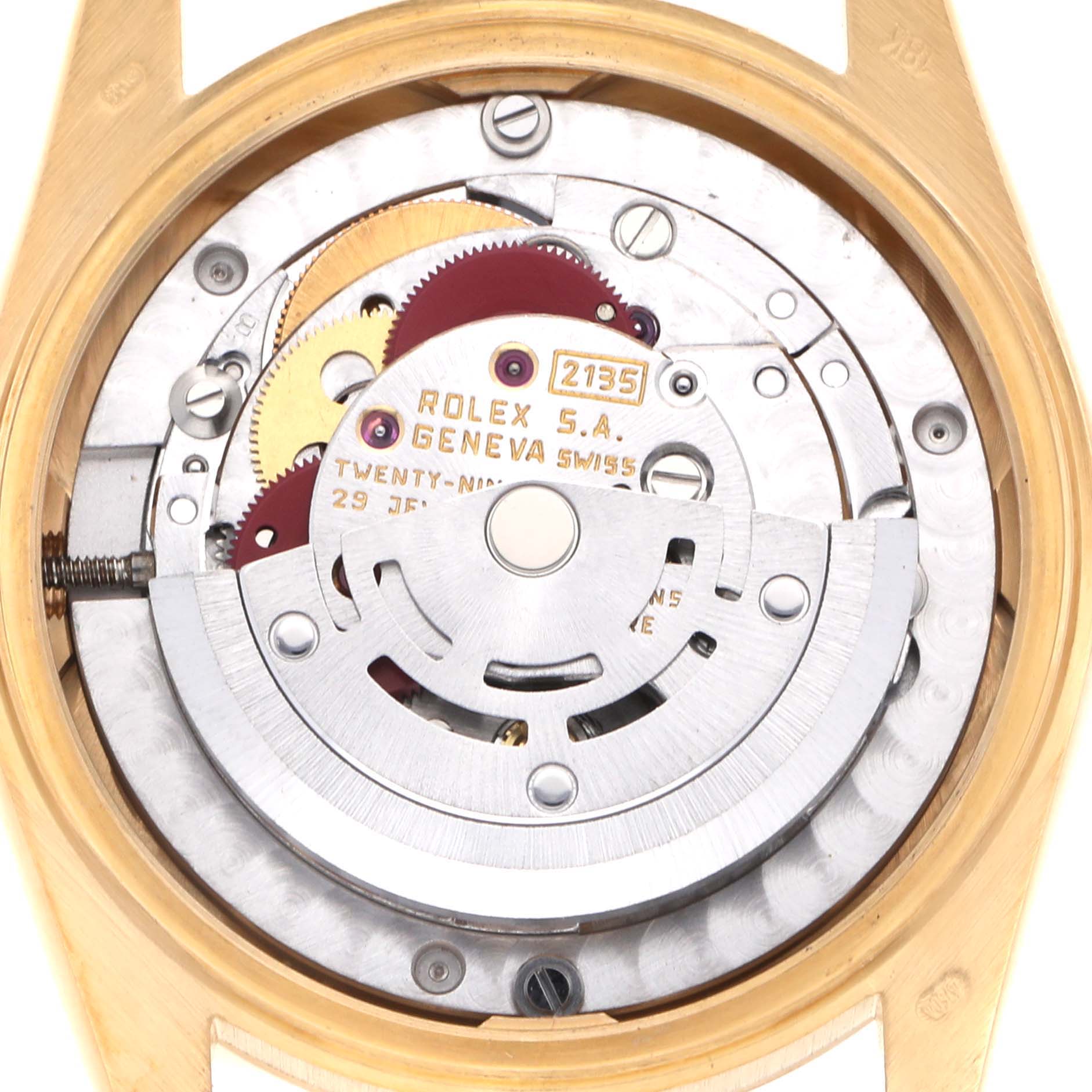 The image shows the internal movement of a Rolex Mid-Size 68278 Women's Yellow Gold White Dial watch from a top view, highlighting gears and the rotor.