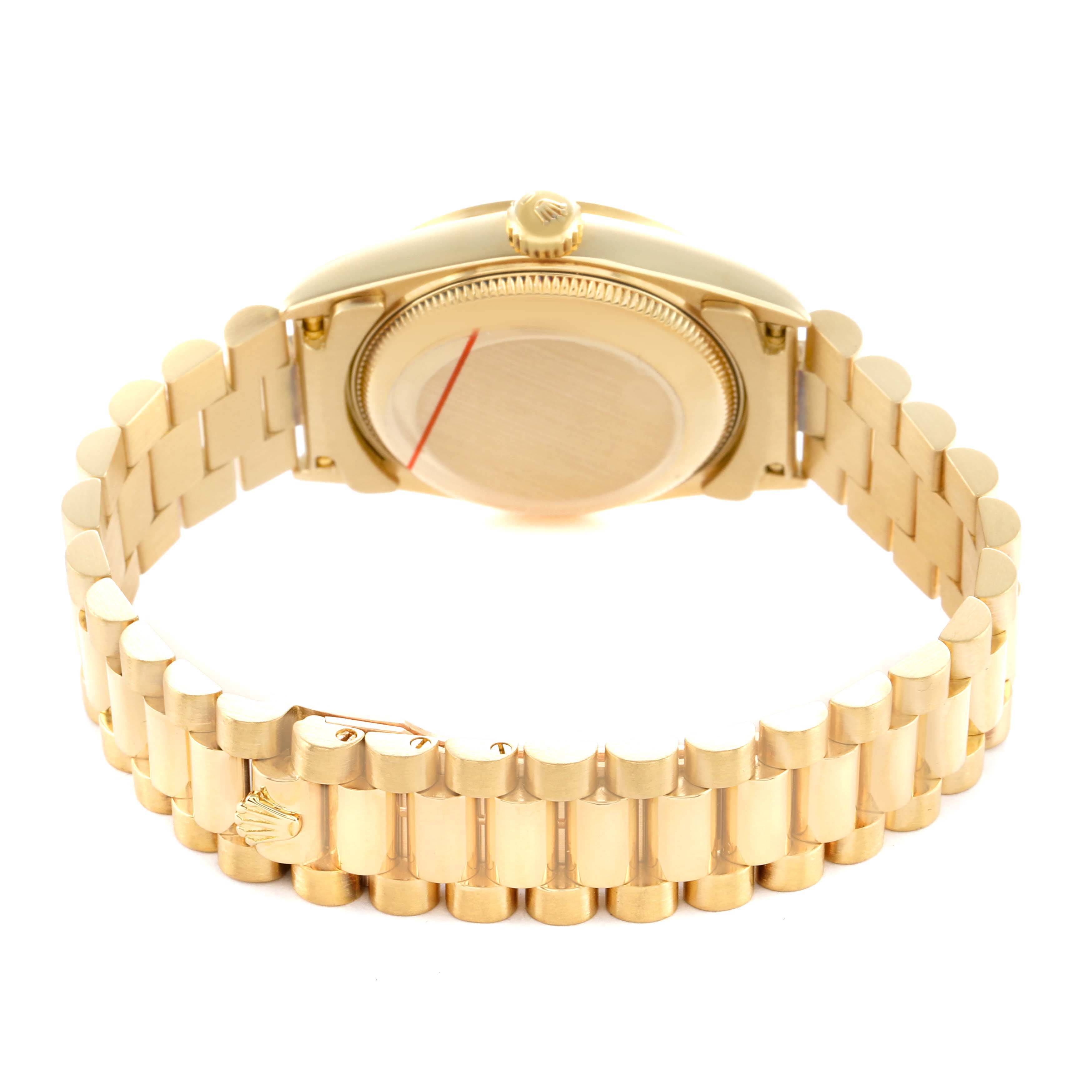 The image shows the back and bracelet of a Mid-Size Rolex watch at an angle emphasizing the clasp and case back.