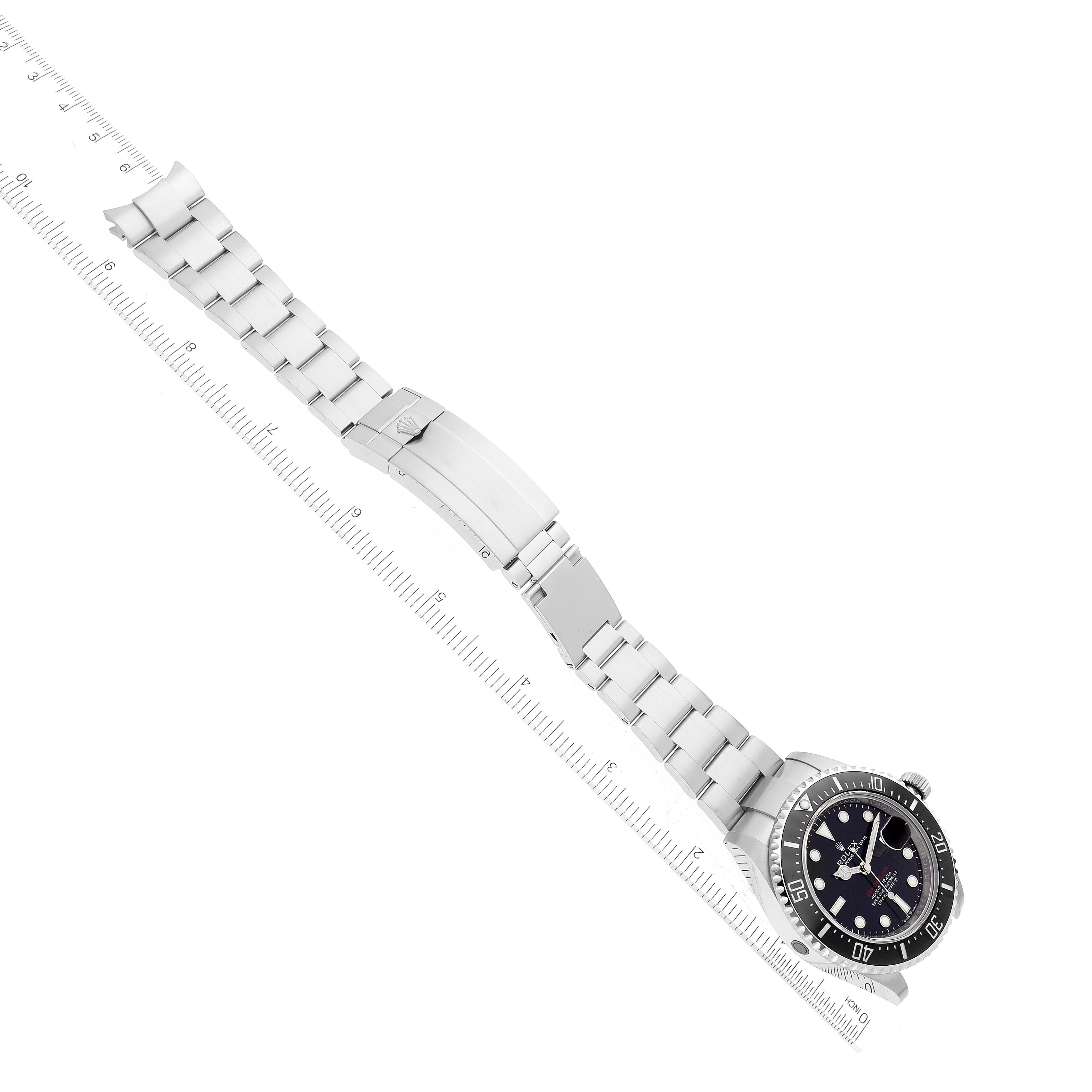 The image shows a top-down view of a Rolex Sea-Dweller 126600 Men
s Stainless Steel Black Dial 126600 Men
s Stainless Steel Black Dial watch, displaying the face, bezel, bracelet, and clasp of the watch.