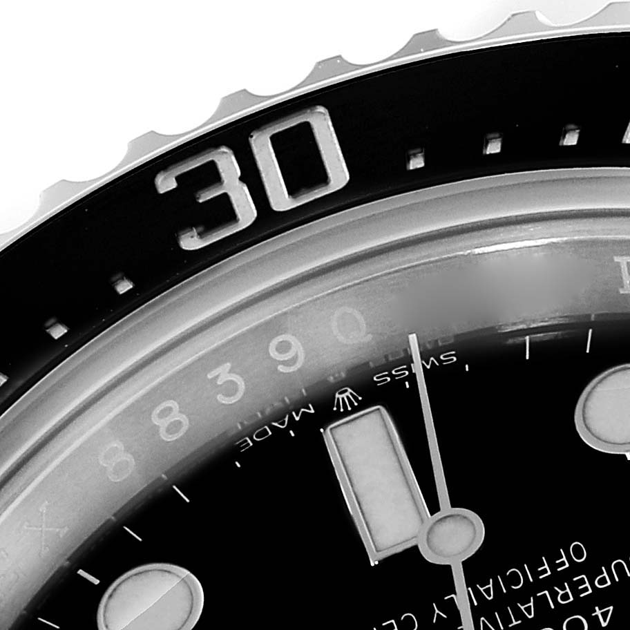 The image shows a close-up of the rotating bezel and part of the dial of a Rolex Sea-Dweller 126600 Men
s Stainless Steel Black Dial 126600 Men
s Stainless Steel Black Dial watch.