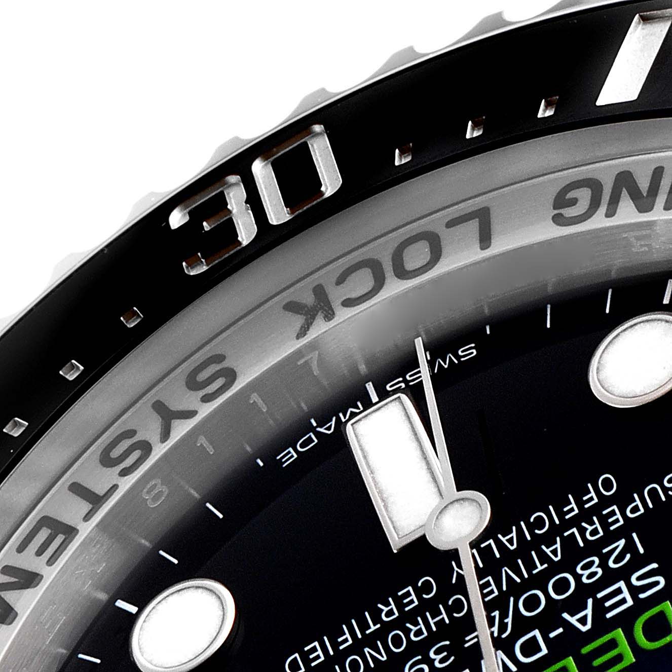 This close-up image shows the bezel, part of the dial, and the minute hand of the Rolex Sea-Dweller 116660 Men's Stainless Steel Blue Dial 116660 Men's Stainless Steel Blue Dial watch.