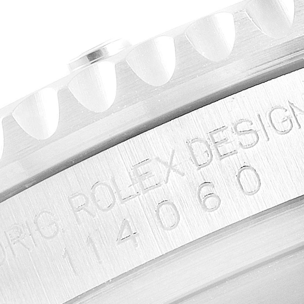 This image shows the side view of a Rolex Submariner 114060 Men
s Stainless Steel Black Dial 114060 Men
s Stainless Steel Black Dial watch, highlighting the model number and design engraving.