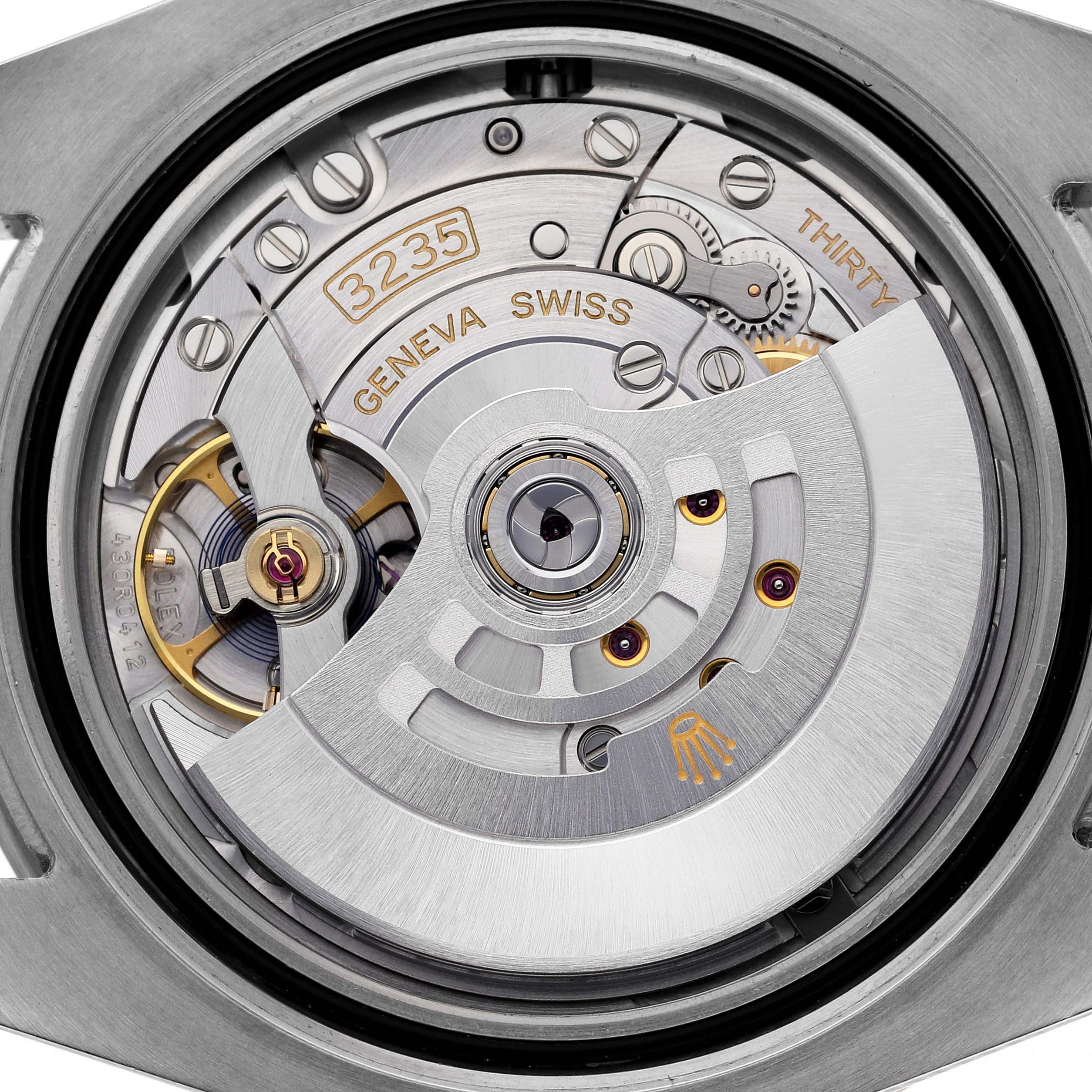 The image shows the movement of a Rolex Submariner 126613LB Men's Steel and Gold (two tone) Blue Dial 126613LB Men's Steel and Gold (two tone) Blue Dial watch, focusing on its intricate internal mechanics.