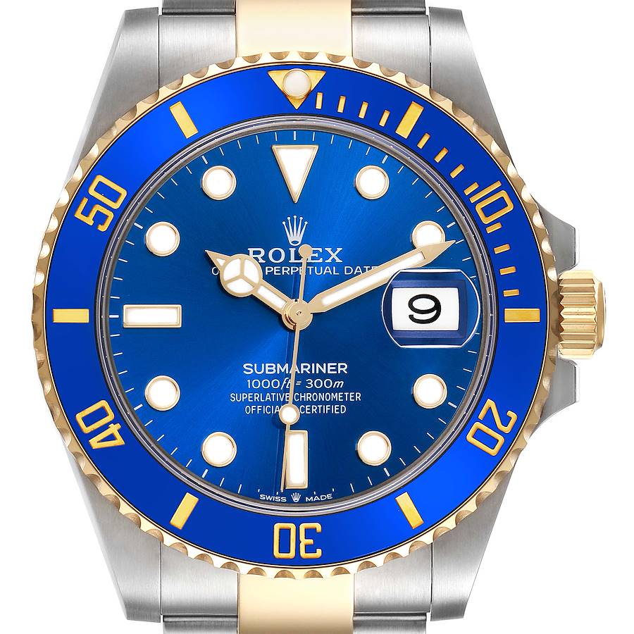 The image shows a front view of the Rolex Submariner watch, highlighting the blue dial, bezel, and gold accents.