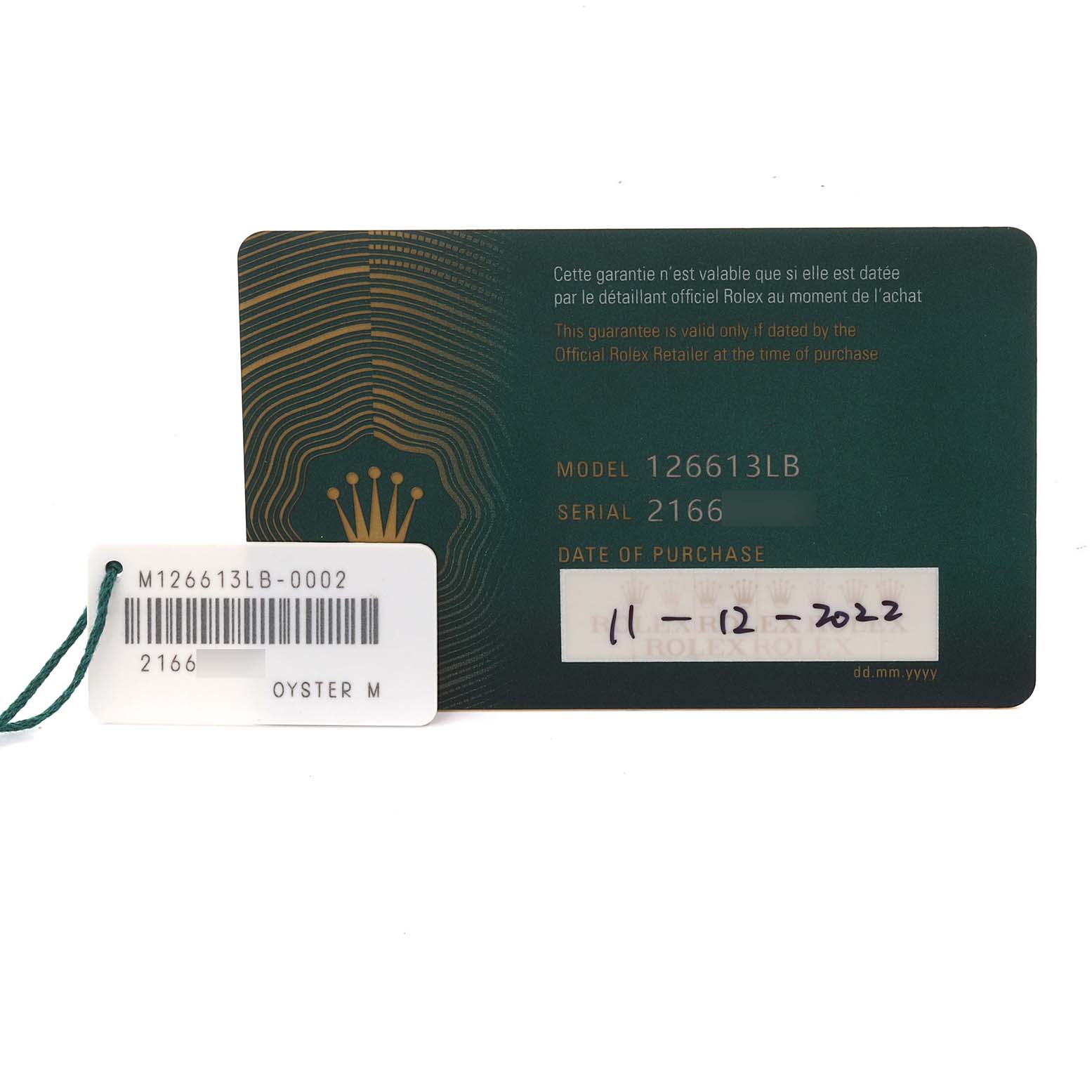 The image shows the warranty card and a tag for the Rolex Submariner 126613LB Men's Steel and Gold (two tone) Blue Dial 126613LB Men's Steel and Gold (two tone) Blue Dial model 126613LB.