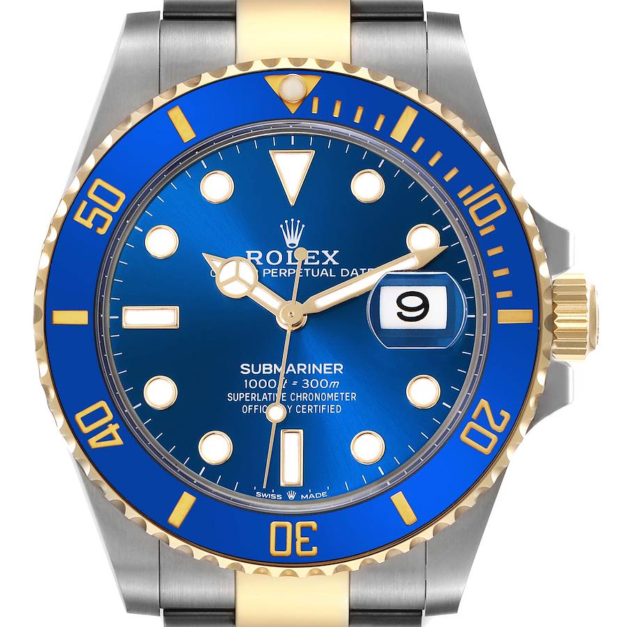 The Rolex Submariner watch is shown from a top-down angle, highlighting its blue dial and bezel, gold accents, and date feature.