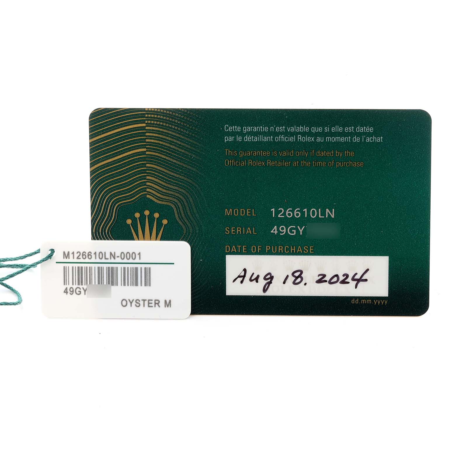 The image shows a warranty card and tag for a Rolex Submariner 126610LN Men
s Stainless Steel Black Dial 126610LN Men
s Stainless Steel Black Dial, model 126610LN.