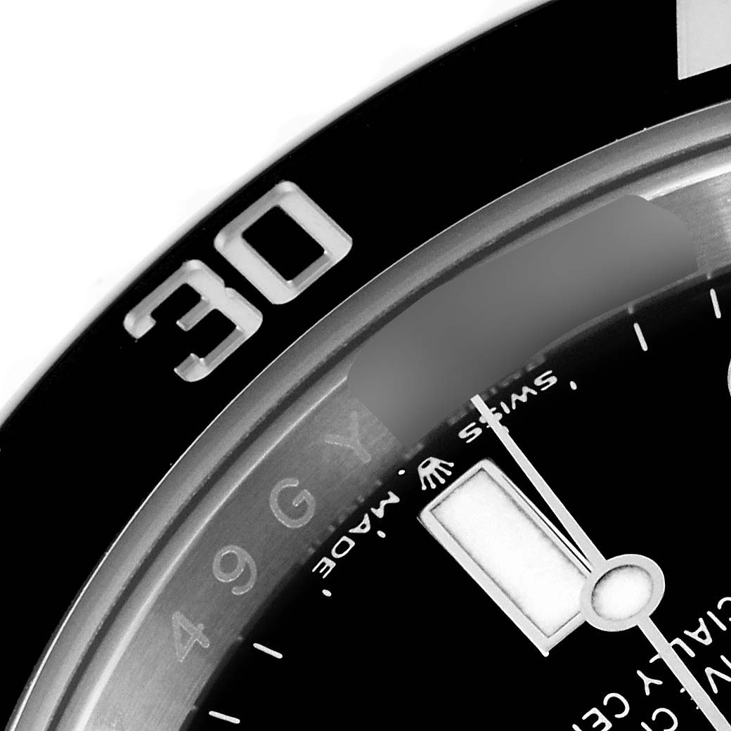 The image shows a close-up of the bezel and part of the dial of a Rolex Submariner 126610LN Men
s Stainless Steel Black Dial 126610LN Men
s Stainless Steel Black Dial, focusing on the "30" mark and hour hand.