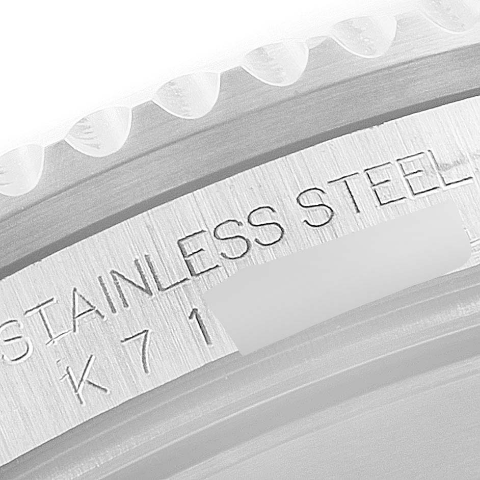 The image shows an angled close-up of the stainless steel bezel and engraving on the Rolex Submariner 16610 Men's Stainless Steel Black Dial 16610 Men's Stainless Steel Black Dial watch.