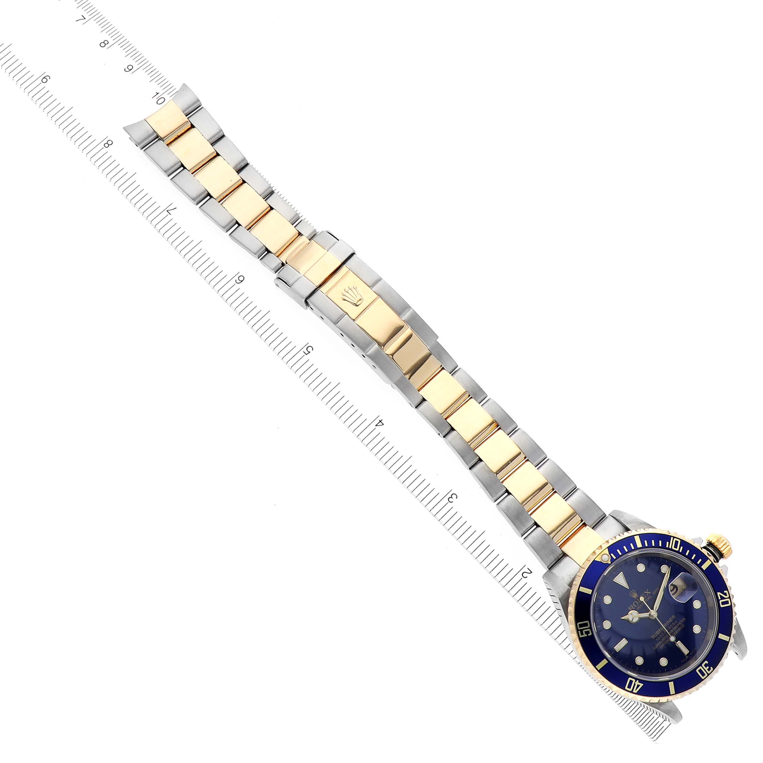 The Rolex Submariner 16613 Men's Steel and Gold (two tone) Blue Dial 16613 Men's Steel and Gold (two tone) Blue Dial watch is shown from an overhead angle, highlighting the full bracelet and dial.