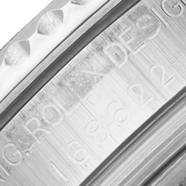 The image shows an angled view of the Rolex Yacht-Master 168622 Men's Stainless Steel Silver Dial 168622 Men's Stainless Steel Silver Dial watch's engraved inner bezel.