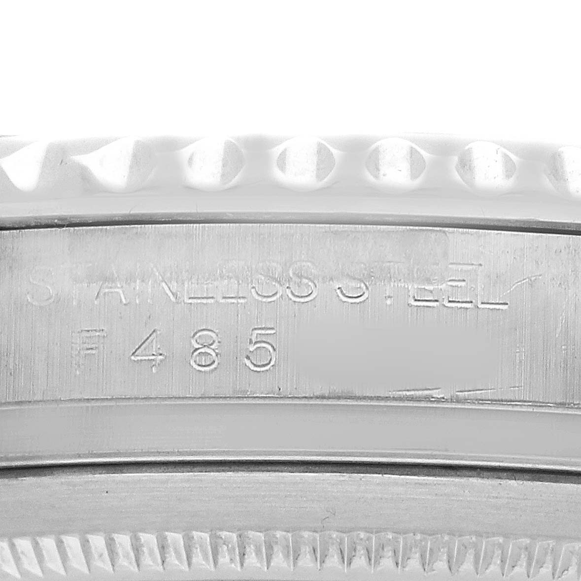 The image shows a close-up of the side of a Rolex Yacht-Master 16622 Men's Stainless Steel Silver Dial watch, highlighting the stainless steel engraving and bezel edge.