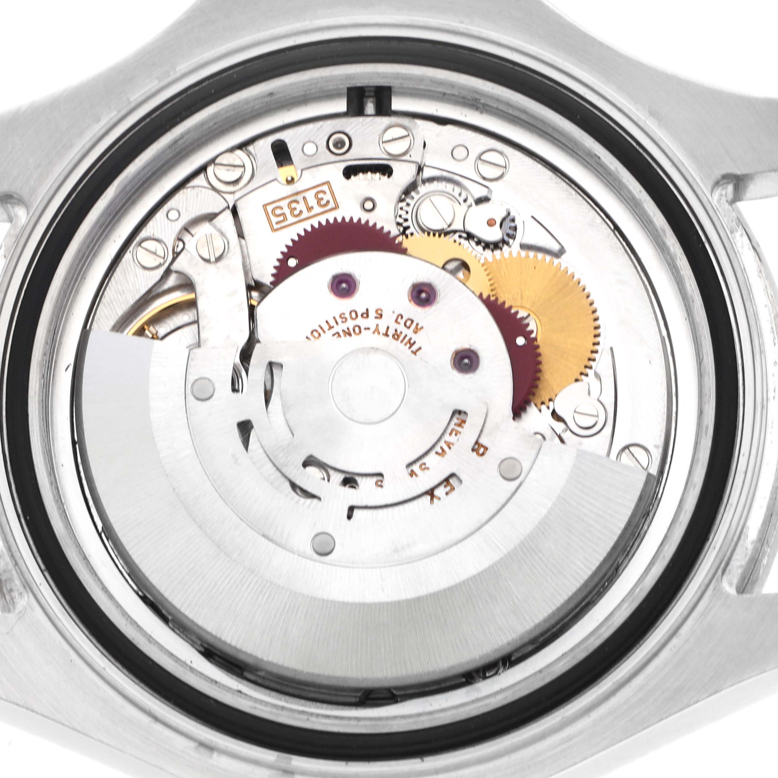 This image shows the movement of a Rolex Yacht-Master 16622 Men's Stainless Steel Silver Dial watch viewed from the back, highlighting gears and components.