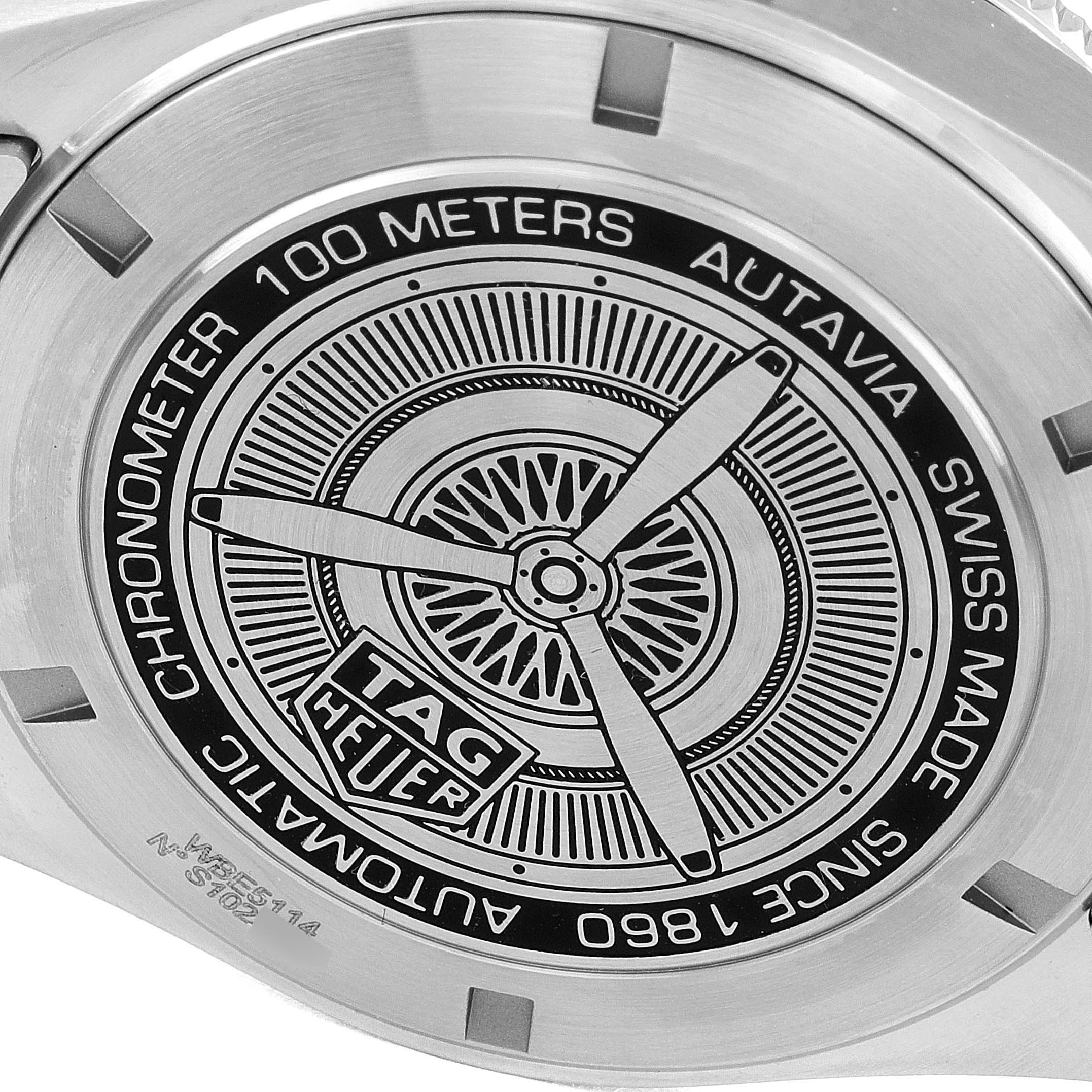 The image shows the back case of an Autavia model watch by Tag Heuer, featuring engraved details.