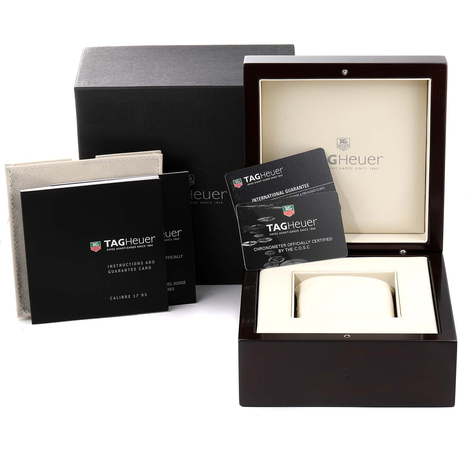 The image shows the packaging for a Tag Heuer Carrera CAV511A Men
s Stainless Steel Black Dial CAV511A Men
s Stainless Steel Black Dial model, including the box, manuals, and warranty card.