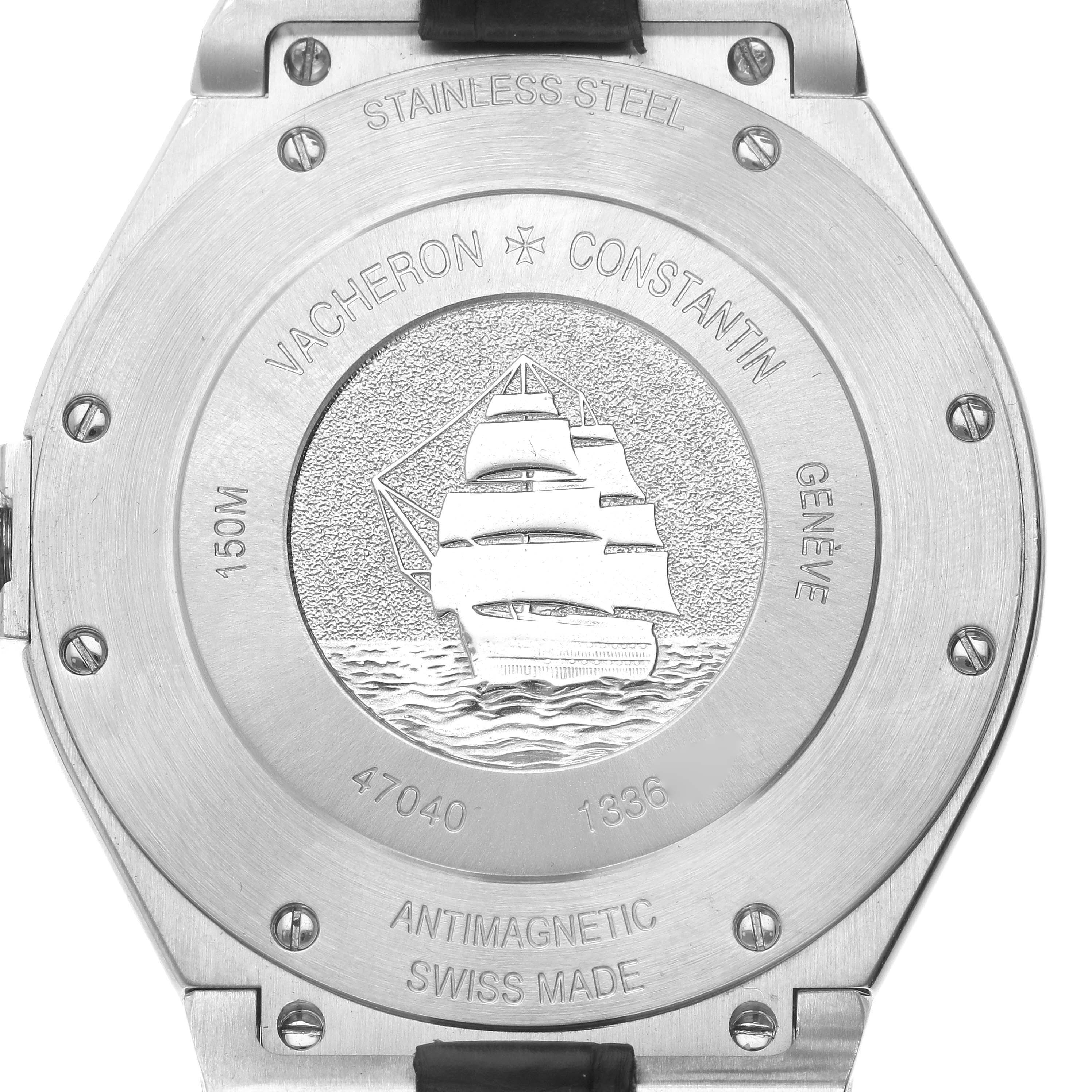 The image shows the case back of the Vacheron Constantin Overseas 47040/000A Men's Stainless Steel Blue Dial 47040/000A Men's Stainless Steel Blue Dial watch, featuring engravings and a ship motif.