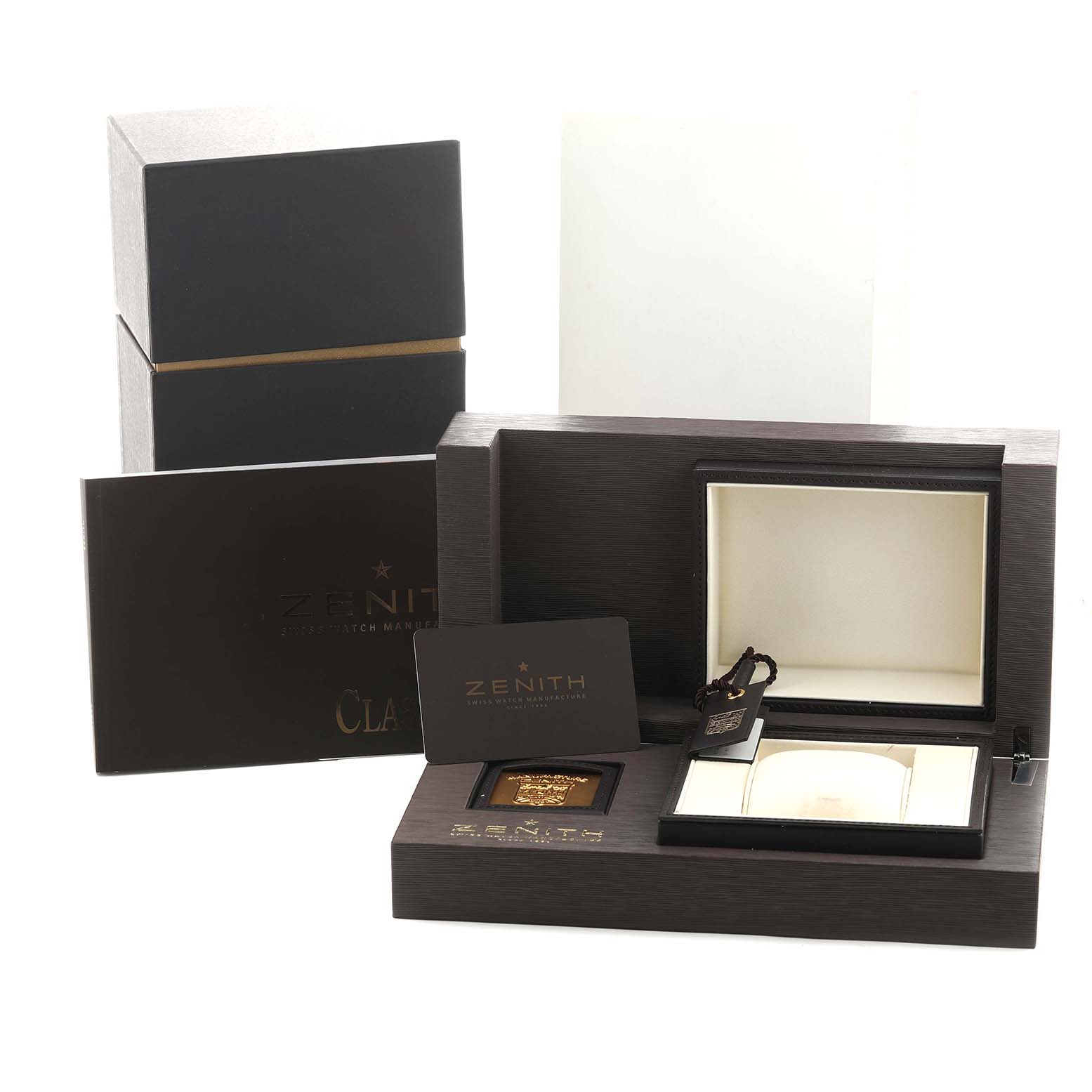 The image shows a Zenith Chronomaster 03.1125.685/01.C490 Men's Stainless Steel Silver Dial watch box and packaging accessories, including a manual and a tag, from a front angle.