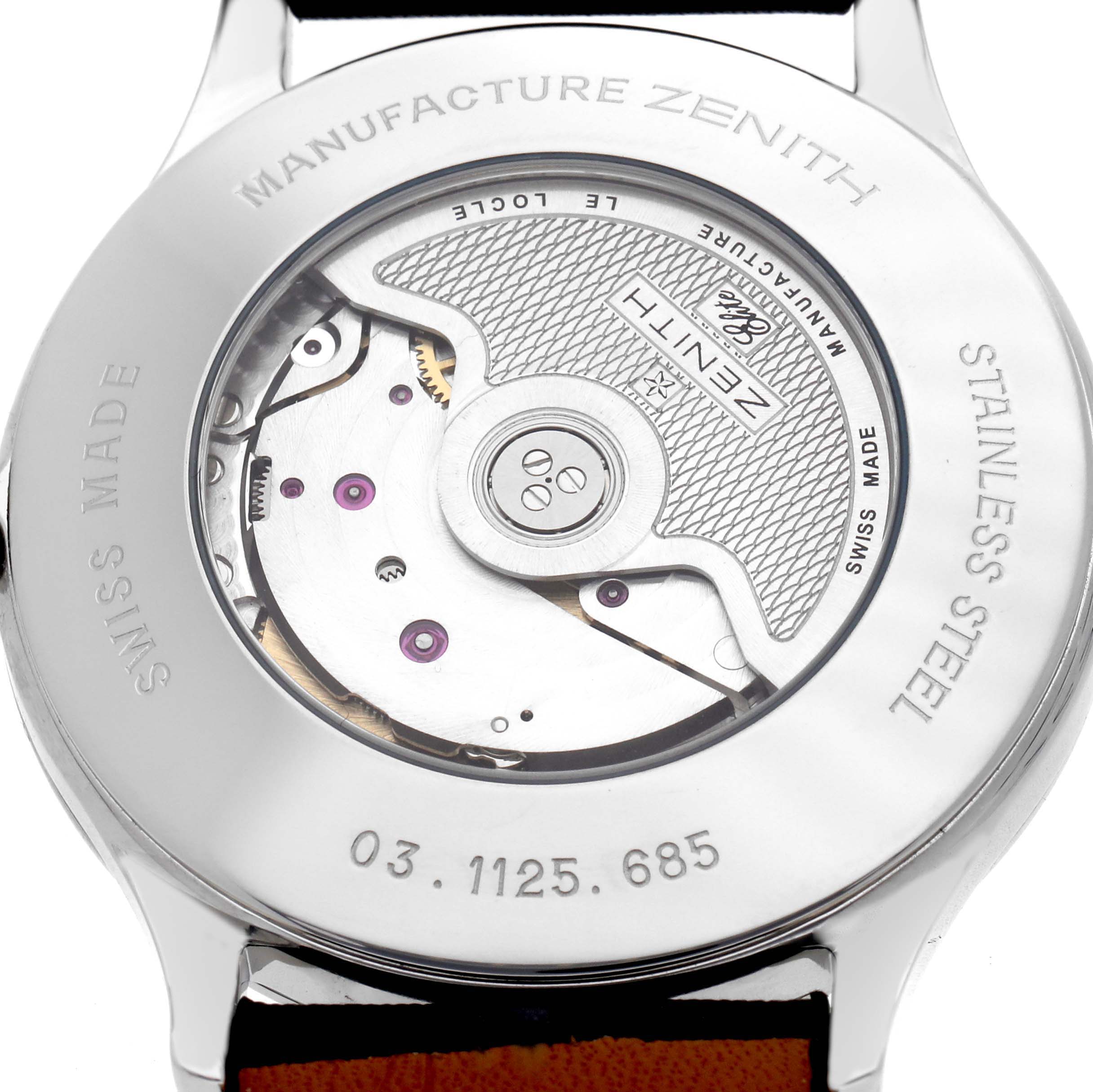 The image shows the back of a Zenith Chronomaster 03.1125.685/01.C490 Men's Stainless Steel Silver Dial watch, revealing the movement through a transparent case back.