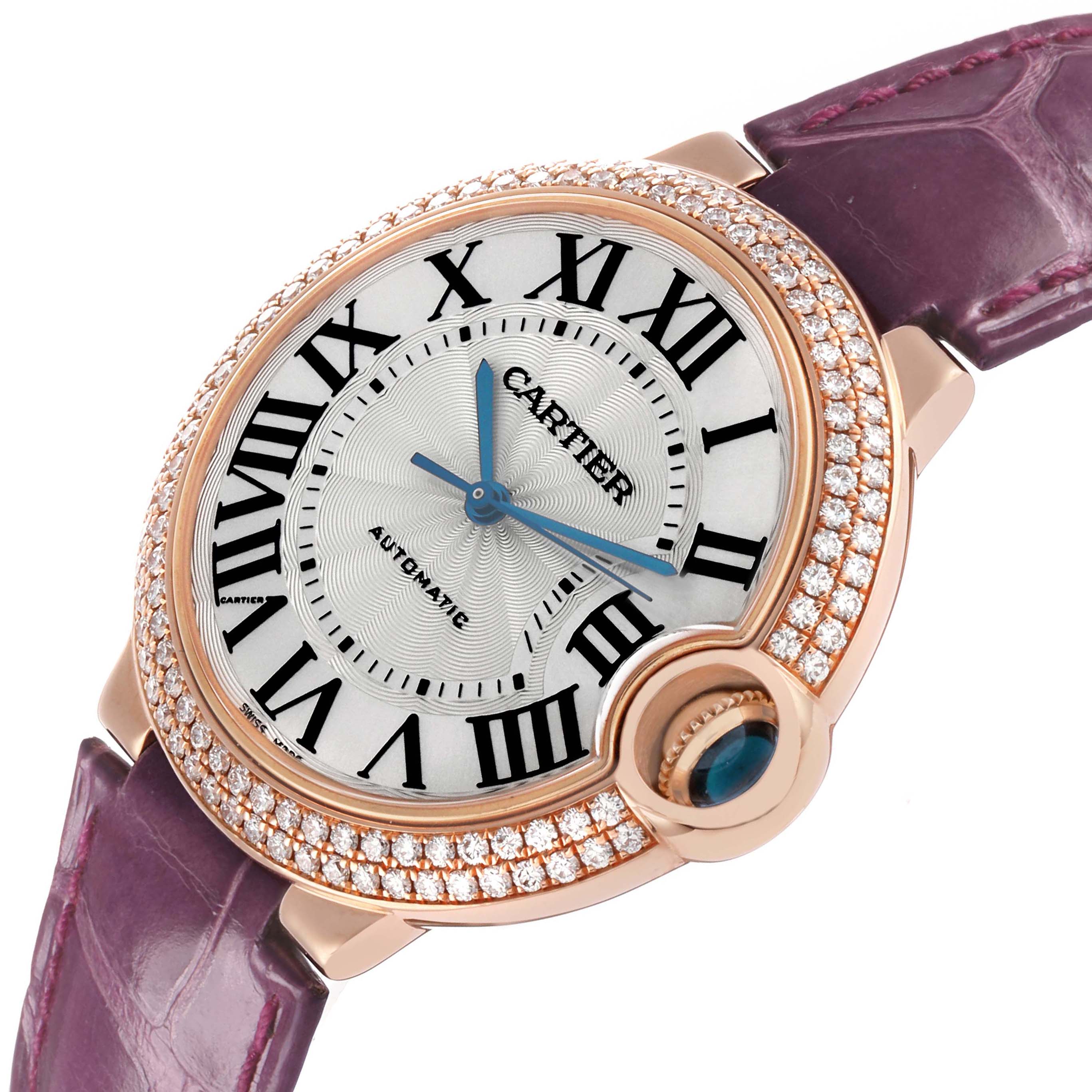 The Cartier Ballon Bleu WE900551 Women's Rose Gold Silver Dial watch is shown at an angled view, displaying the face, bezel, strap, and crown.