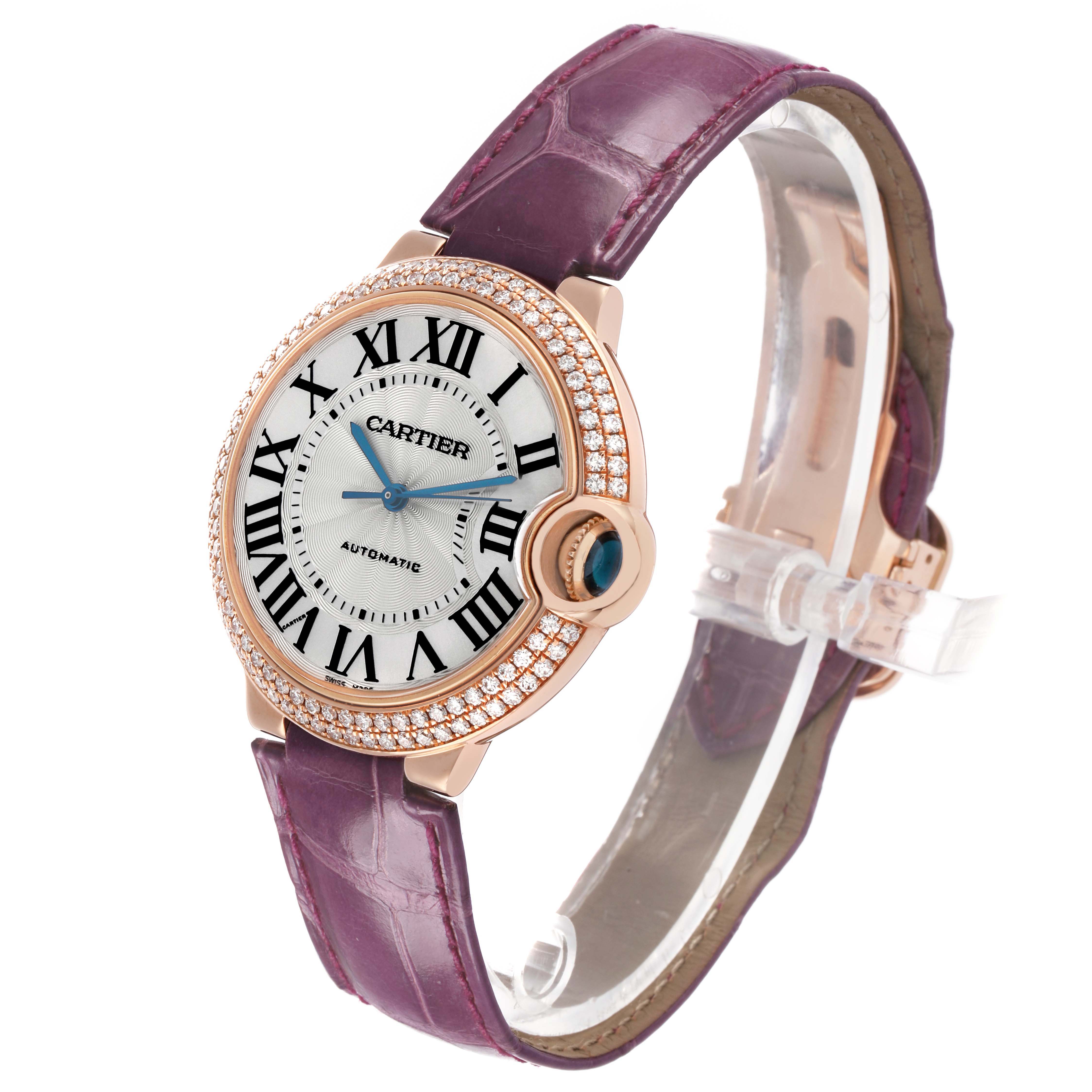 The Ballon Bleu by Cartier is shown at a three-quarter angle, highlighting the face, bezel, crown, and leather strap.