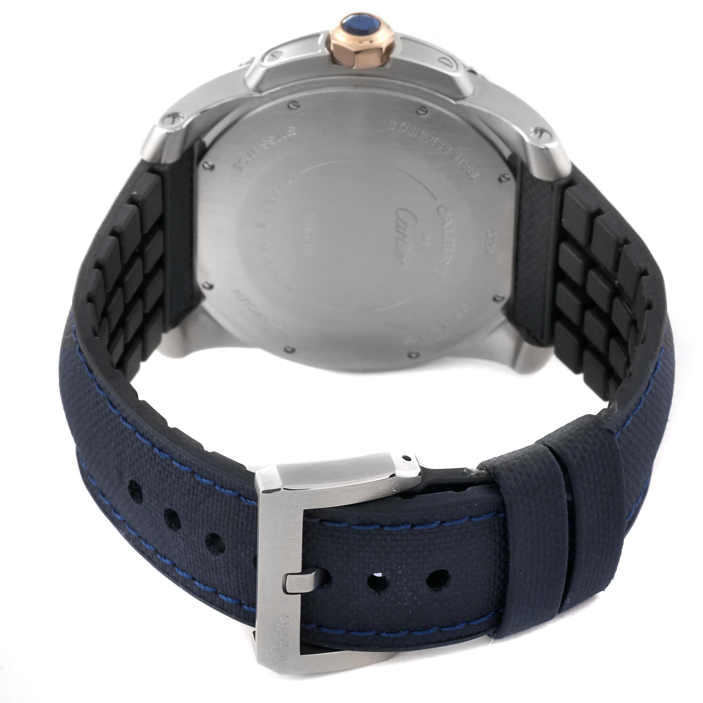 The image shows the back of a Calibre de Cartier watch by Cartier, highlighting the case back and strap.