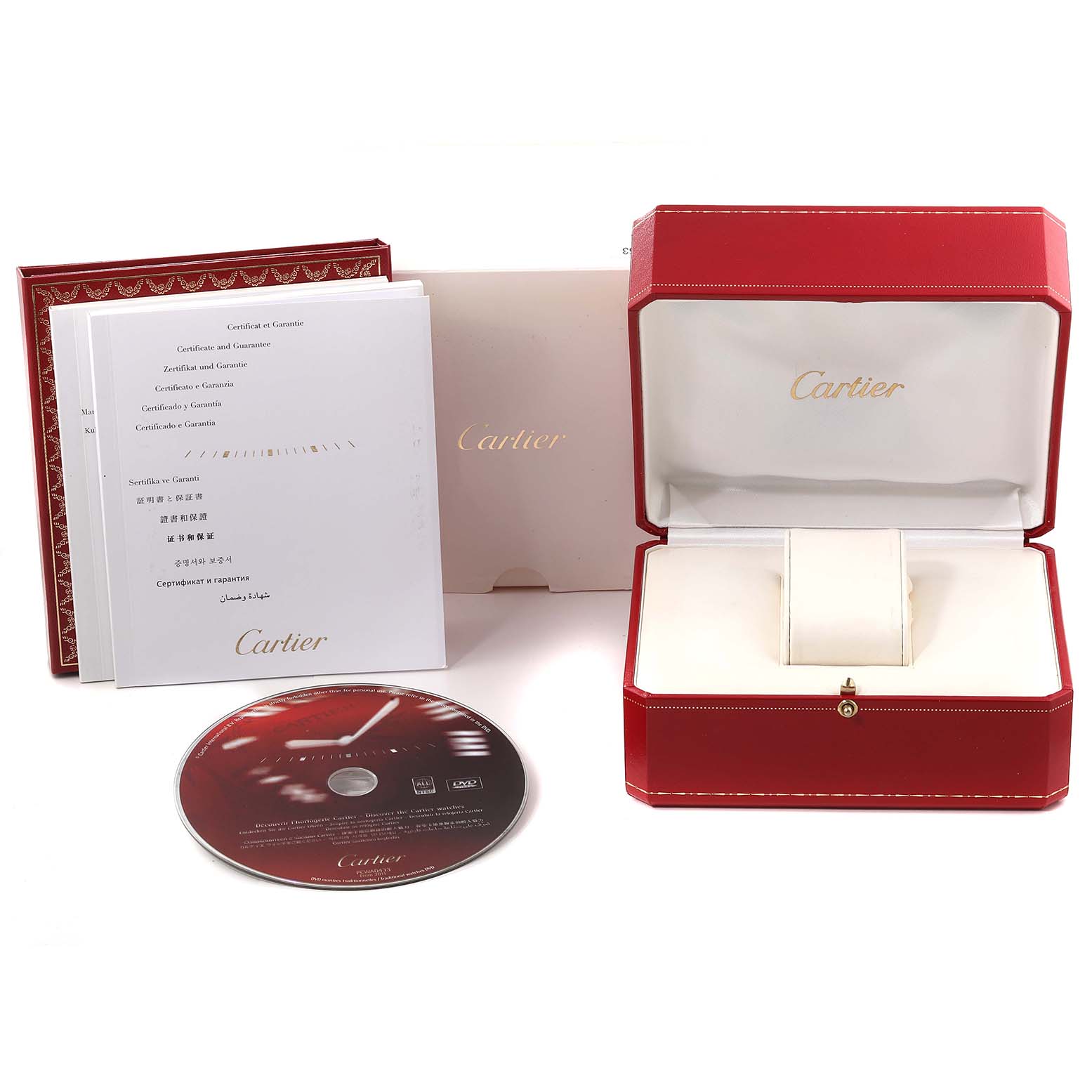 The image shows packaging, manuals, a CD, and an empty watch box for the Calibre de Cartier model by Cartier.