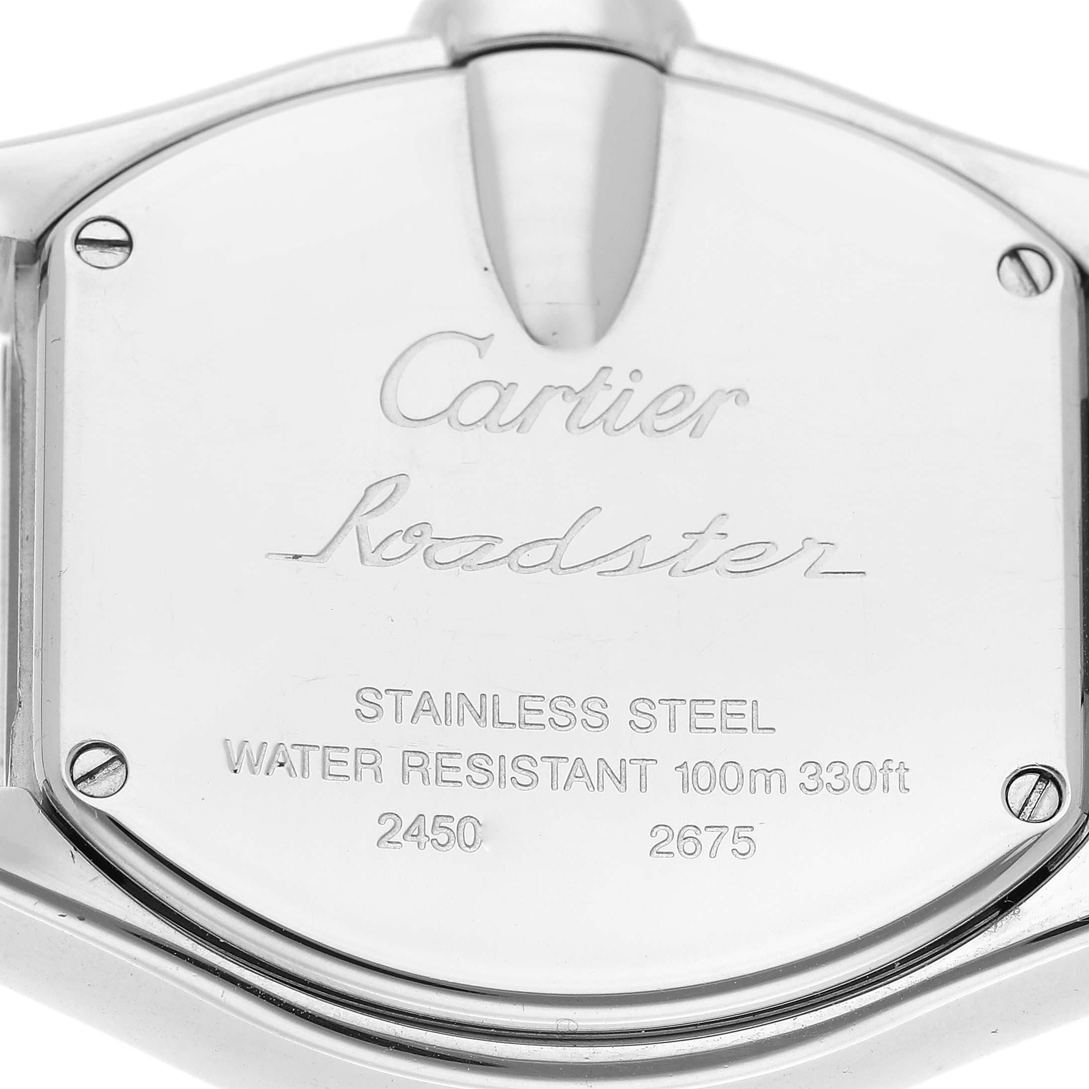 This image shows the back case of a Cartier Roadster W62016V3 Women
s Stainless Steel Silver Dial W62016V3 Women
s Stainless Steel Silver Dial watch, displaying engravings and screws.