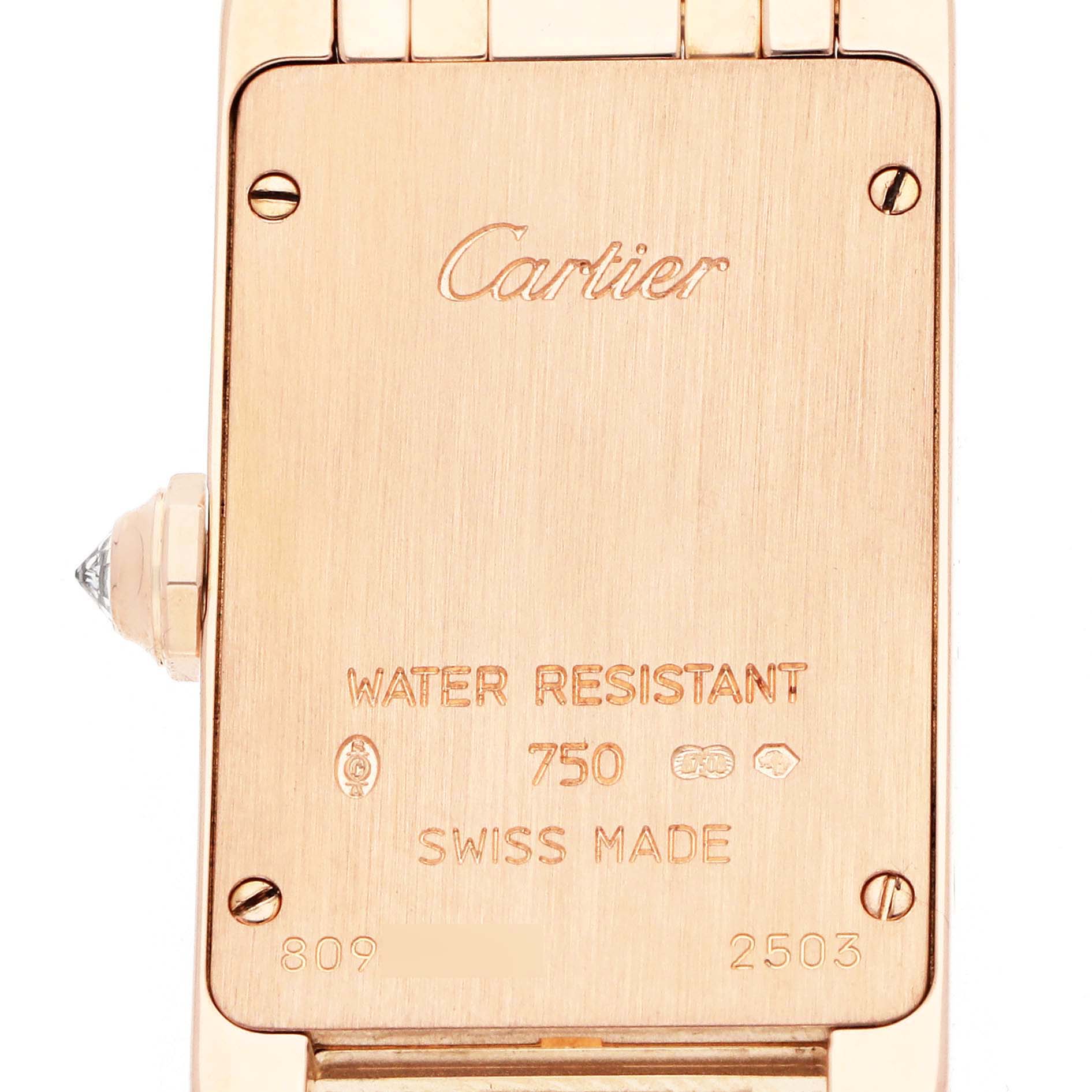 The image shows the case back of the Cartier Tank Americaine WB7079M5 Women's Rose Gold Silver Dial watch, displaying engravings and the winder.