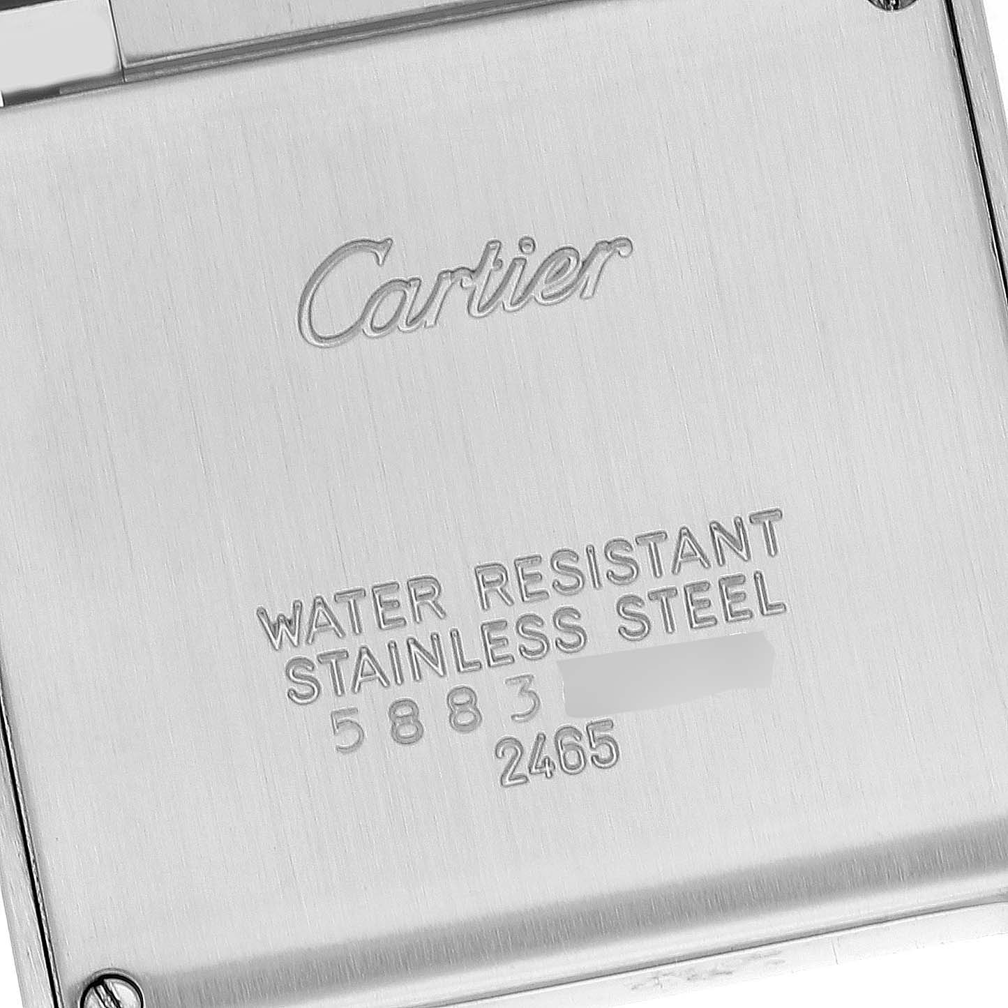 The image shows the back of a Tank Francaise watch by Cartier, highlighting its water resistance and stainless steel construction.