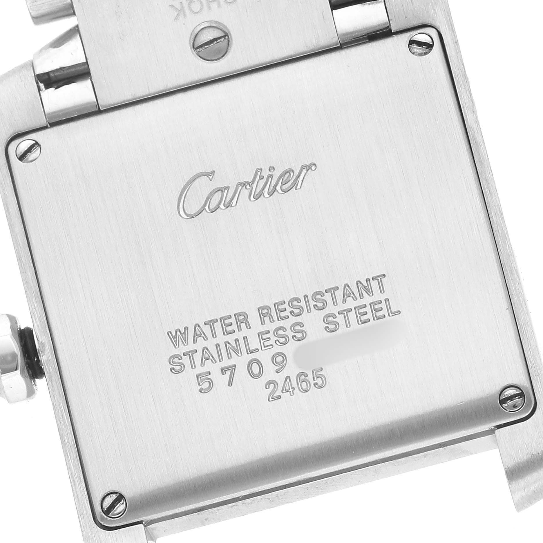 The image shows the back case of a Cartier Tank Française watch, displaying its water resistance and stainless steel marking.