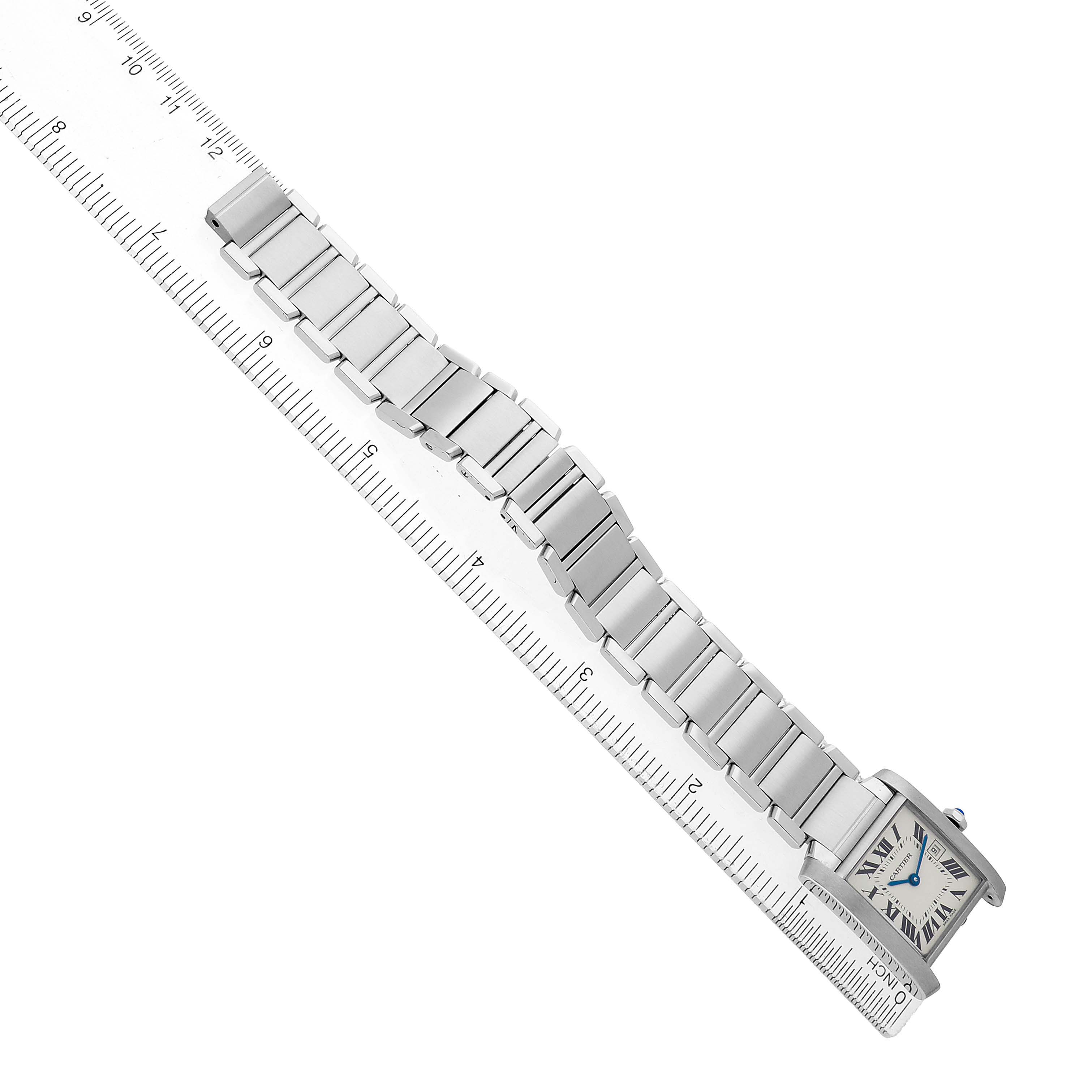 The Cartier Tank Francaise W51011Q3 Women's Stainless Steel Silver Dial watch is shown diagonally, displaying the face, bracelet, and length with a ruler.