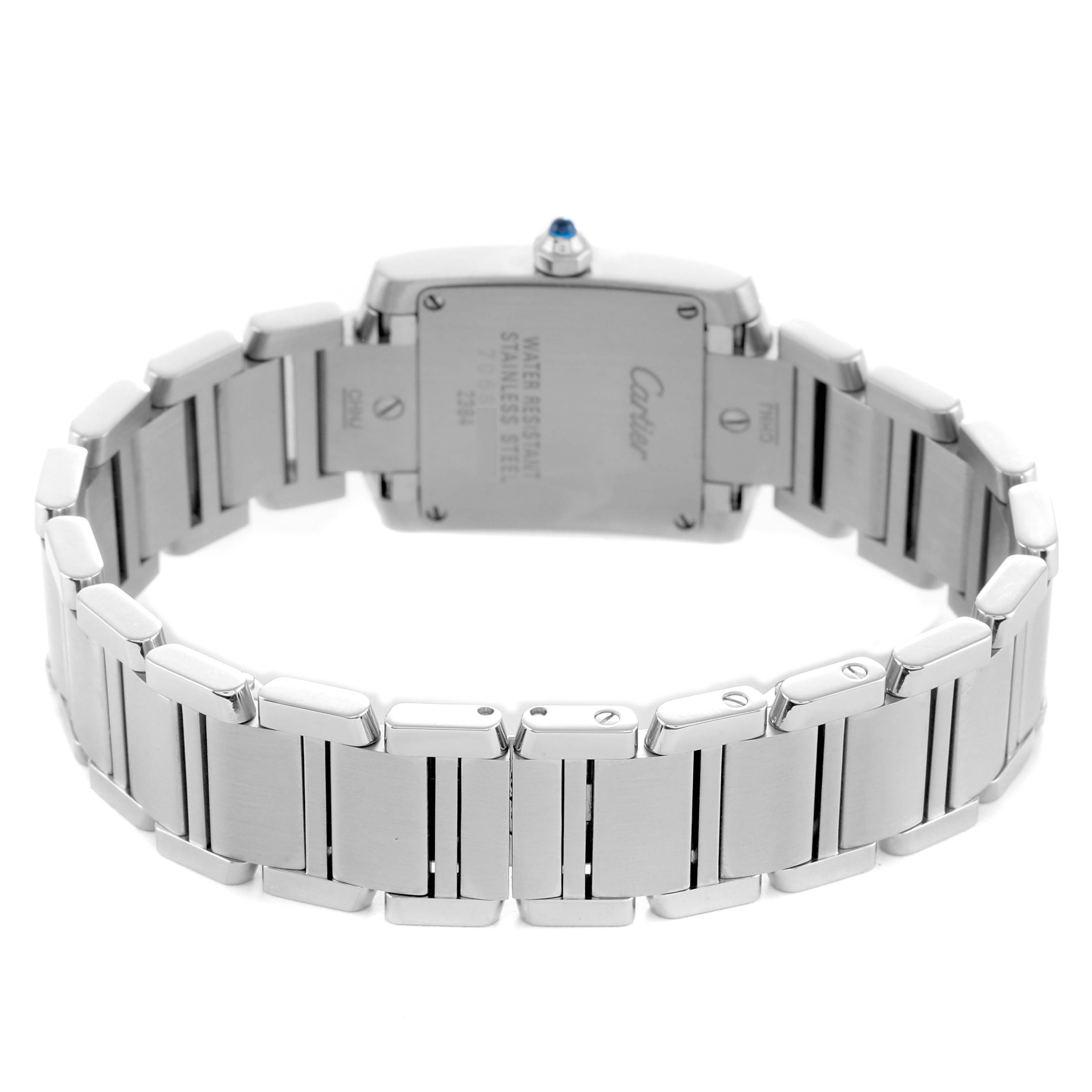 The Cartier Tank Française watch is shown from the back, highlighting the stainless steel case, bracelet, and engraved details.