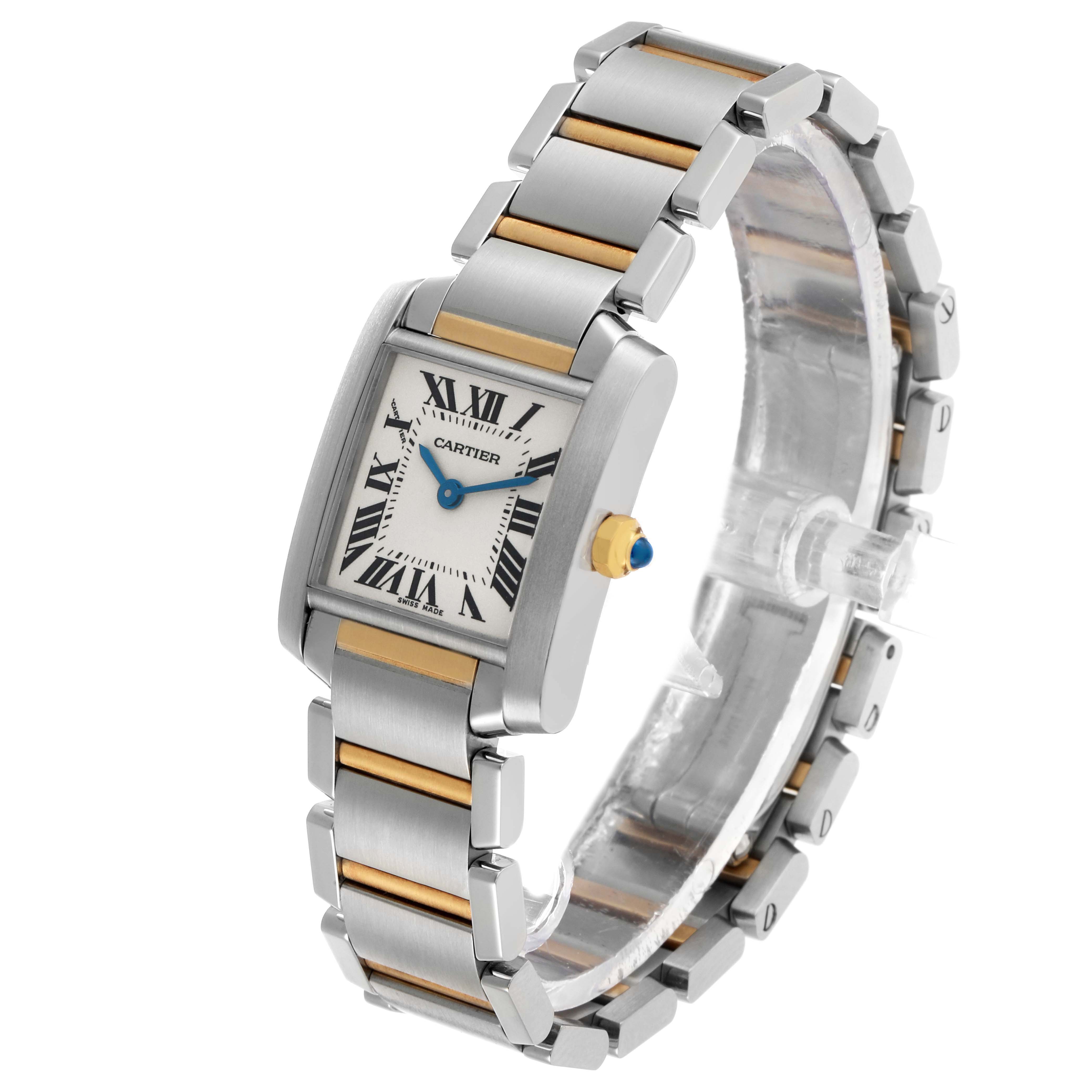 The Cartier Tank Française watch is shown at a slight angle, highlighting the face, crown, and two-tone band.
