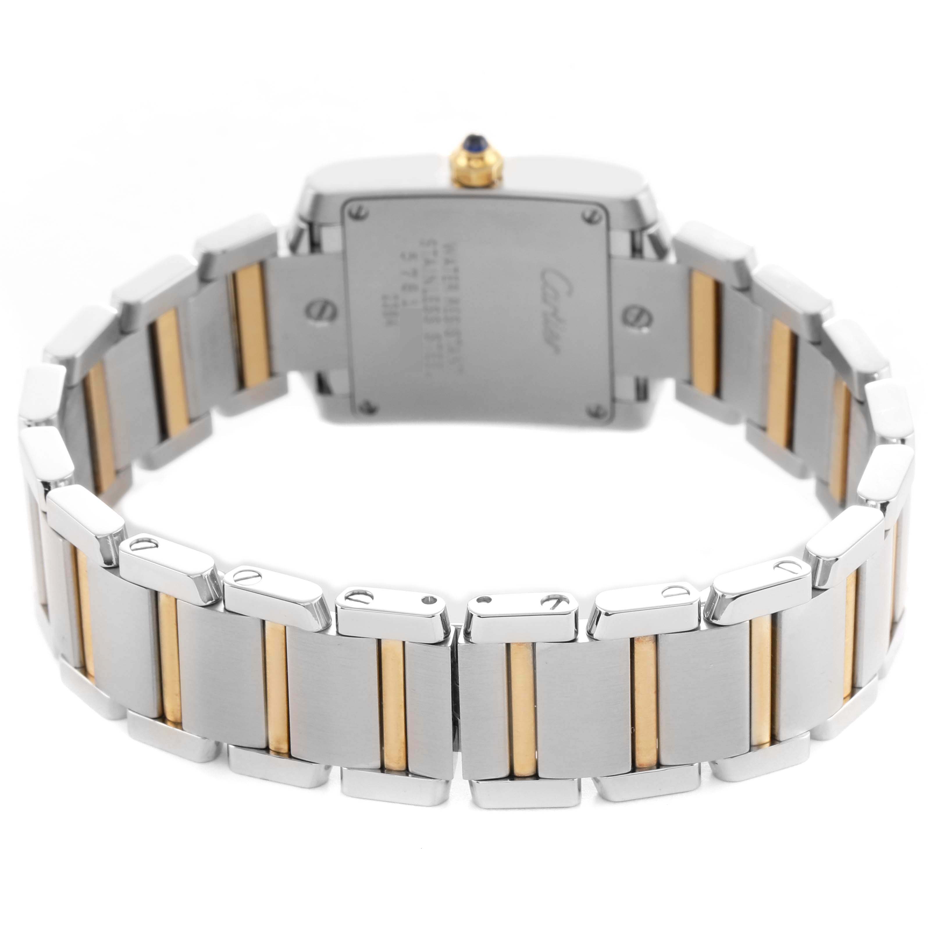 The image shows the back of the Cartier Tank Française watch, highlighting its two-tone metal bracelet and caseback.