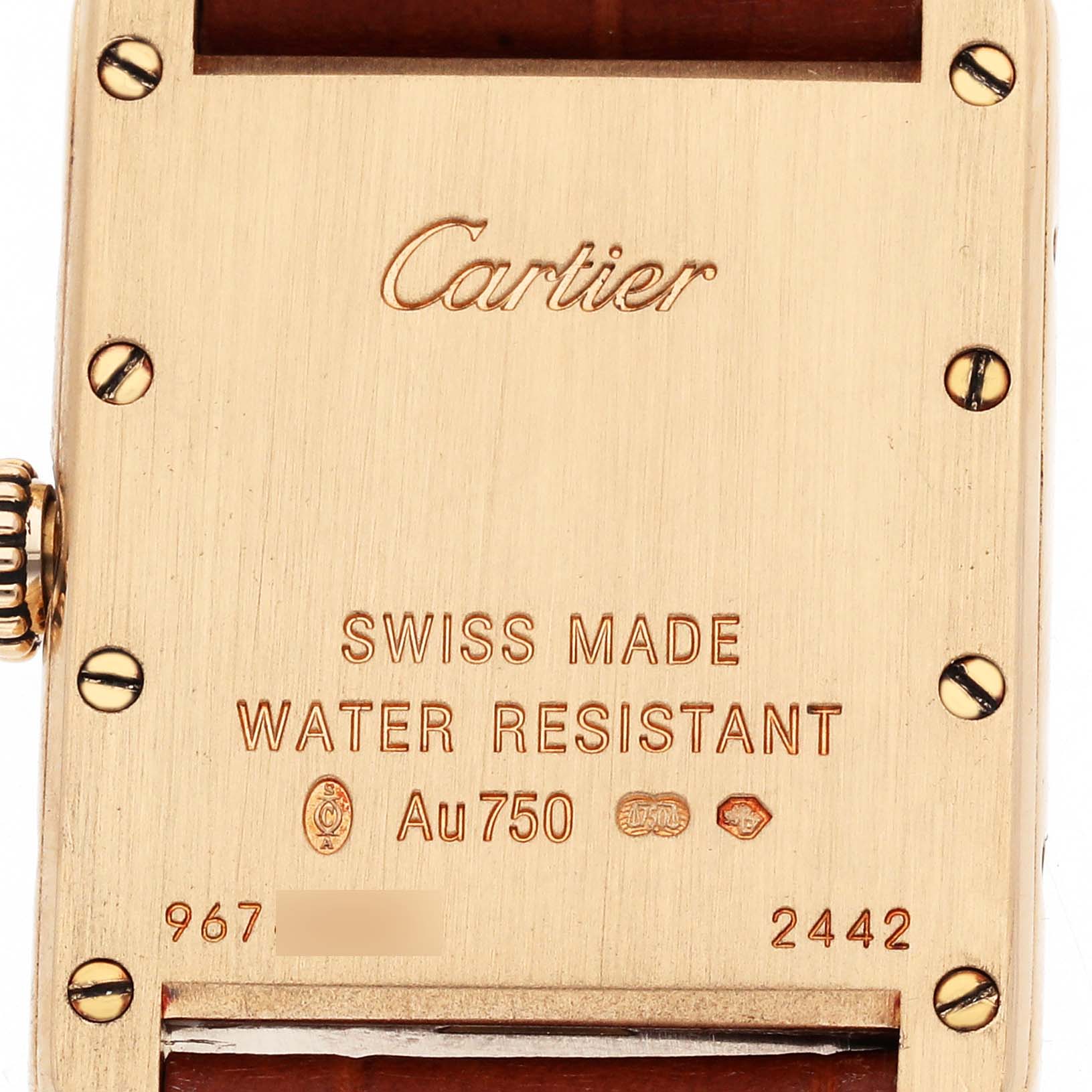 The image shows the back case of a Cartier Tank Louis W1529856 Women's Yellow Gold Silver Dial watch, featuring engravings and screws.