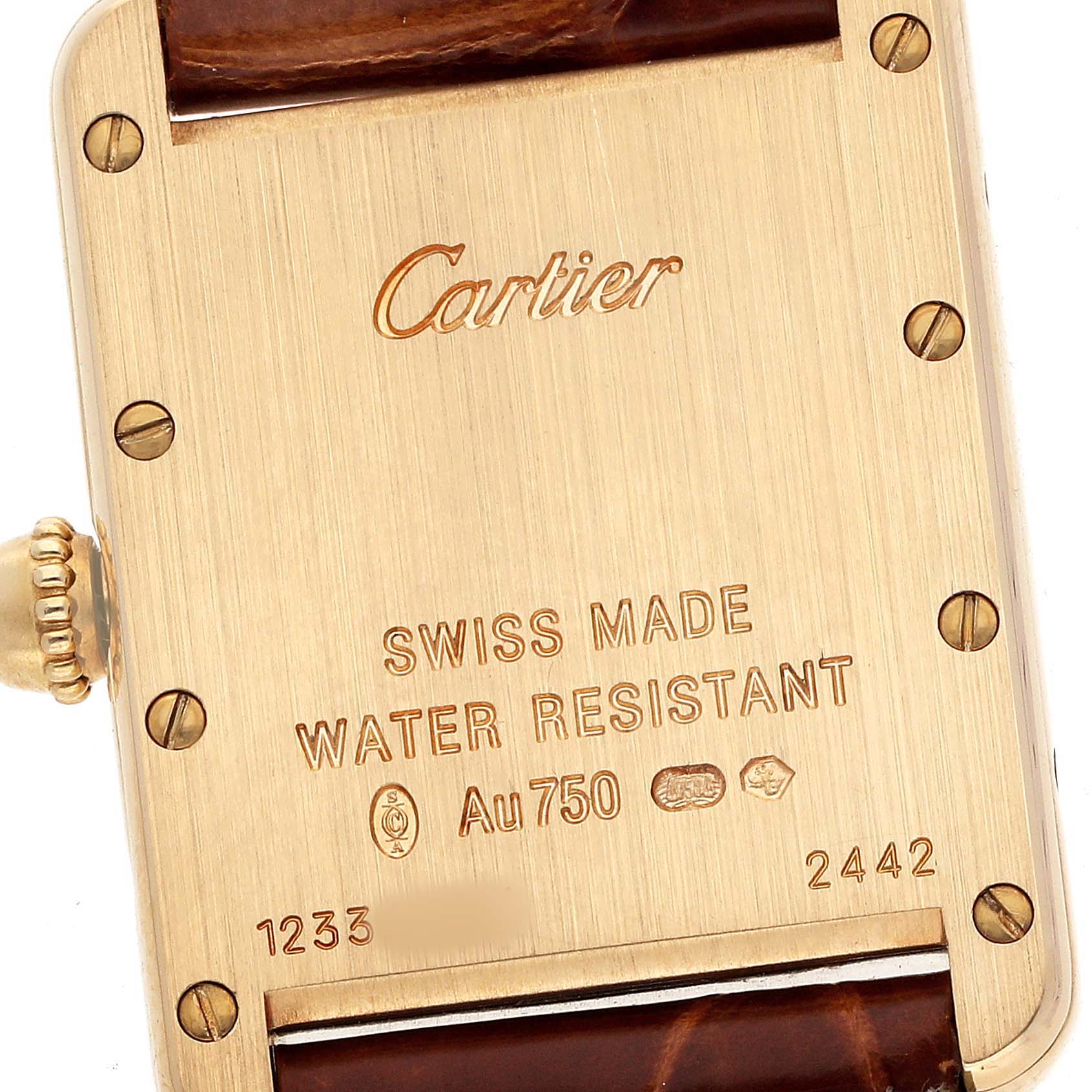 The image shows the back case of a Cartier Tank Louis W1529856 Women's Yellow Gold Silver Dial watch, highlighting the engraved details and crown.