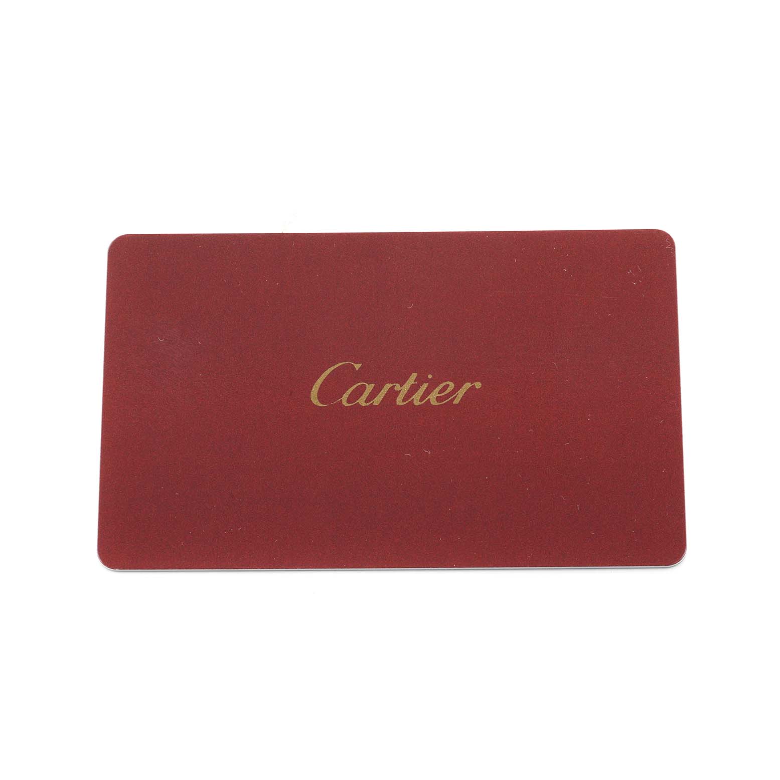 The image shows a red Cartier card, likely an accessory for the Tank Solo model.