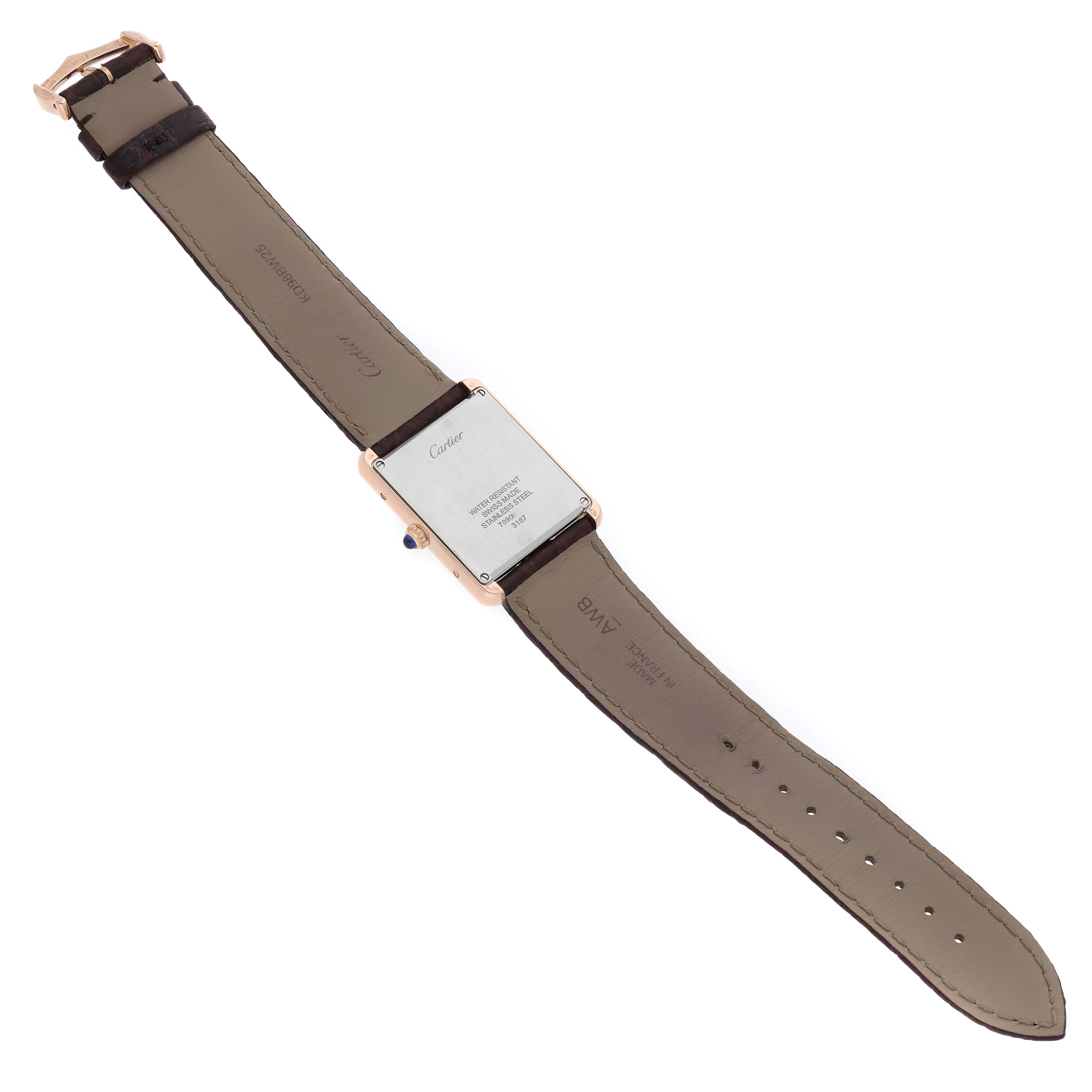 The image shows the back of the Cartier Tank Solo W5200025 Men's Rose Gold Silver Dial watch, highlighting the case back, strap, and buckle from a top-down angle.