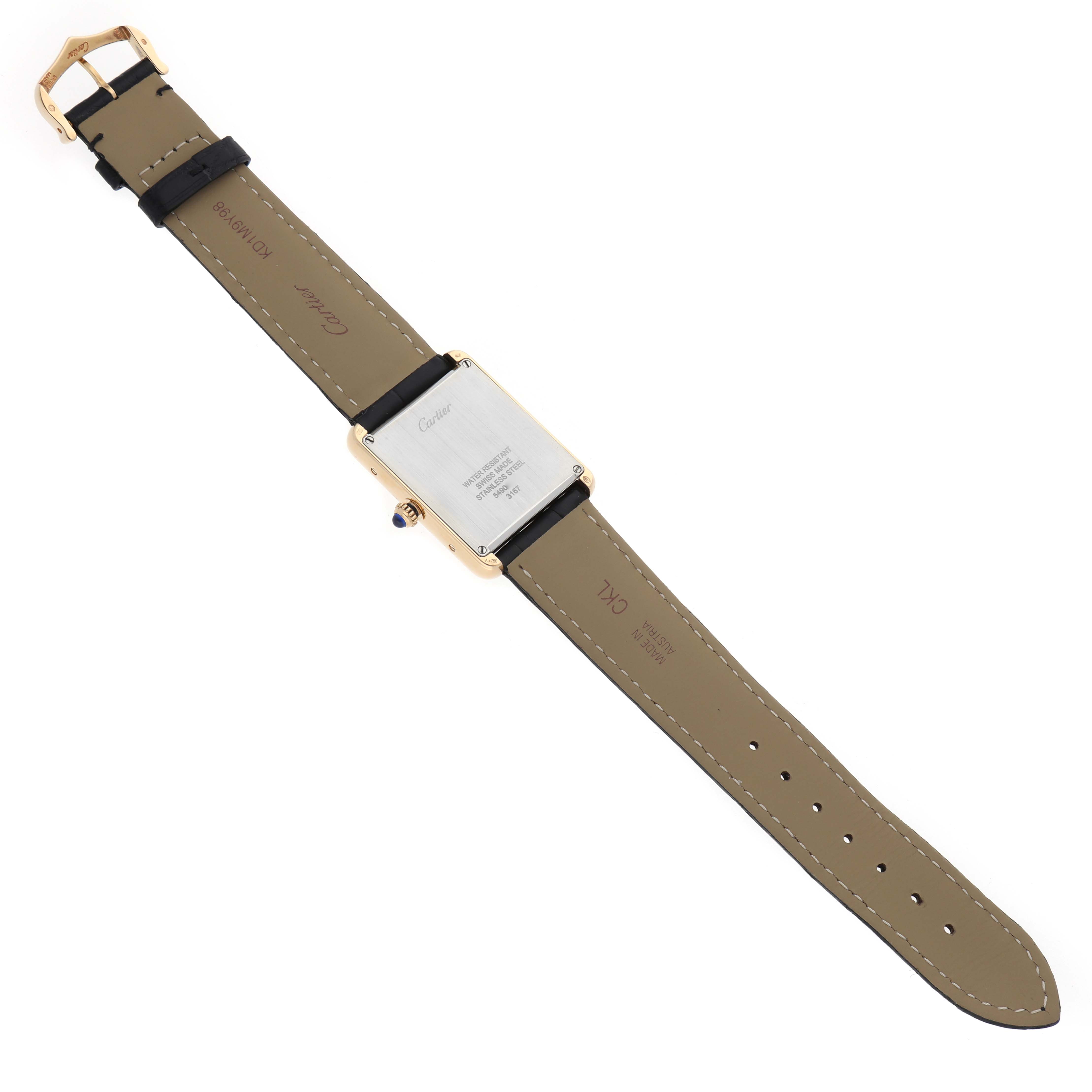 The Cartier Tank Solo W5200004 Men's Yellow Gold Silver Dial watch is shown from the back, displaying the case back, leather strap, and buckle in full view.