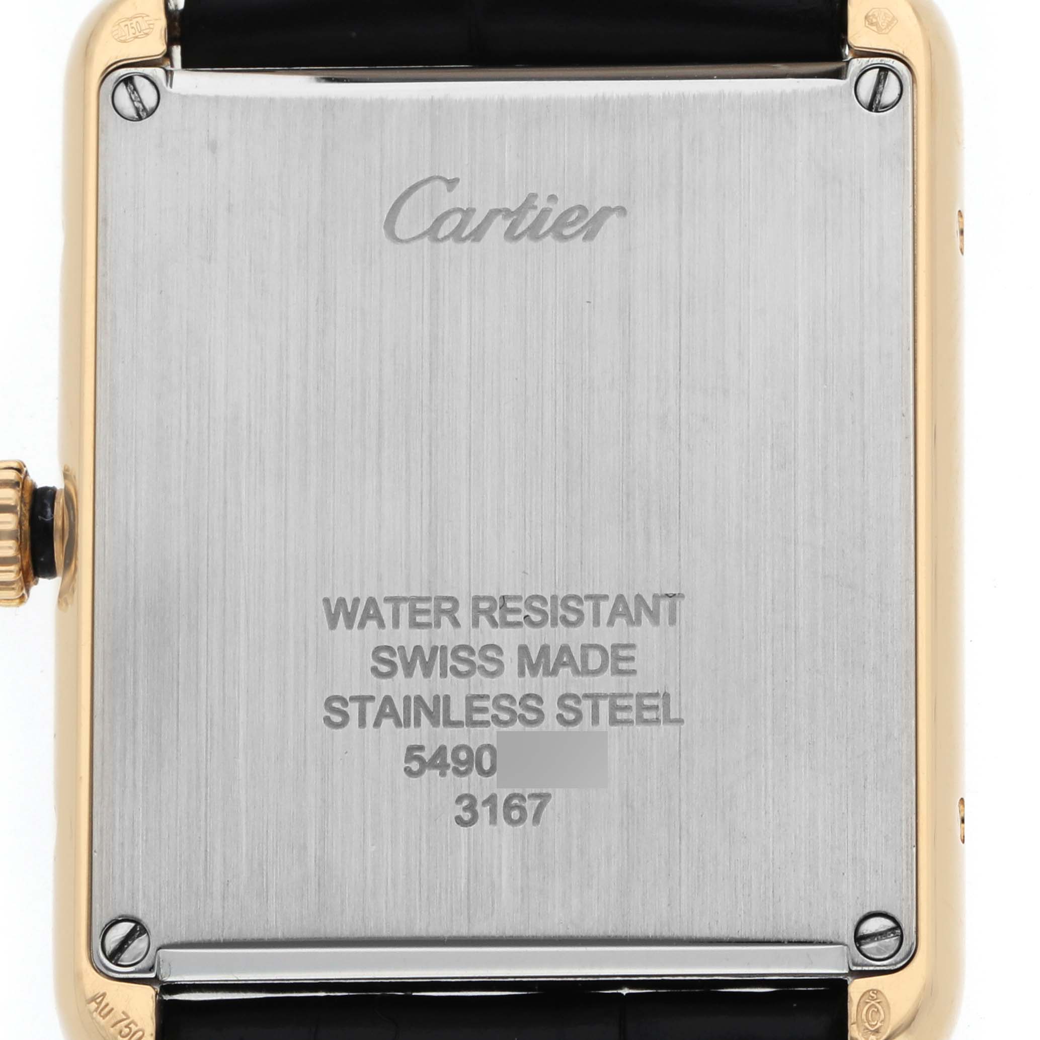 The image shows the back of a Cartier Tank Solo W5200004 Men's Yellow Gold Silver Dial watch, displaying its metal casing and engraving details.