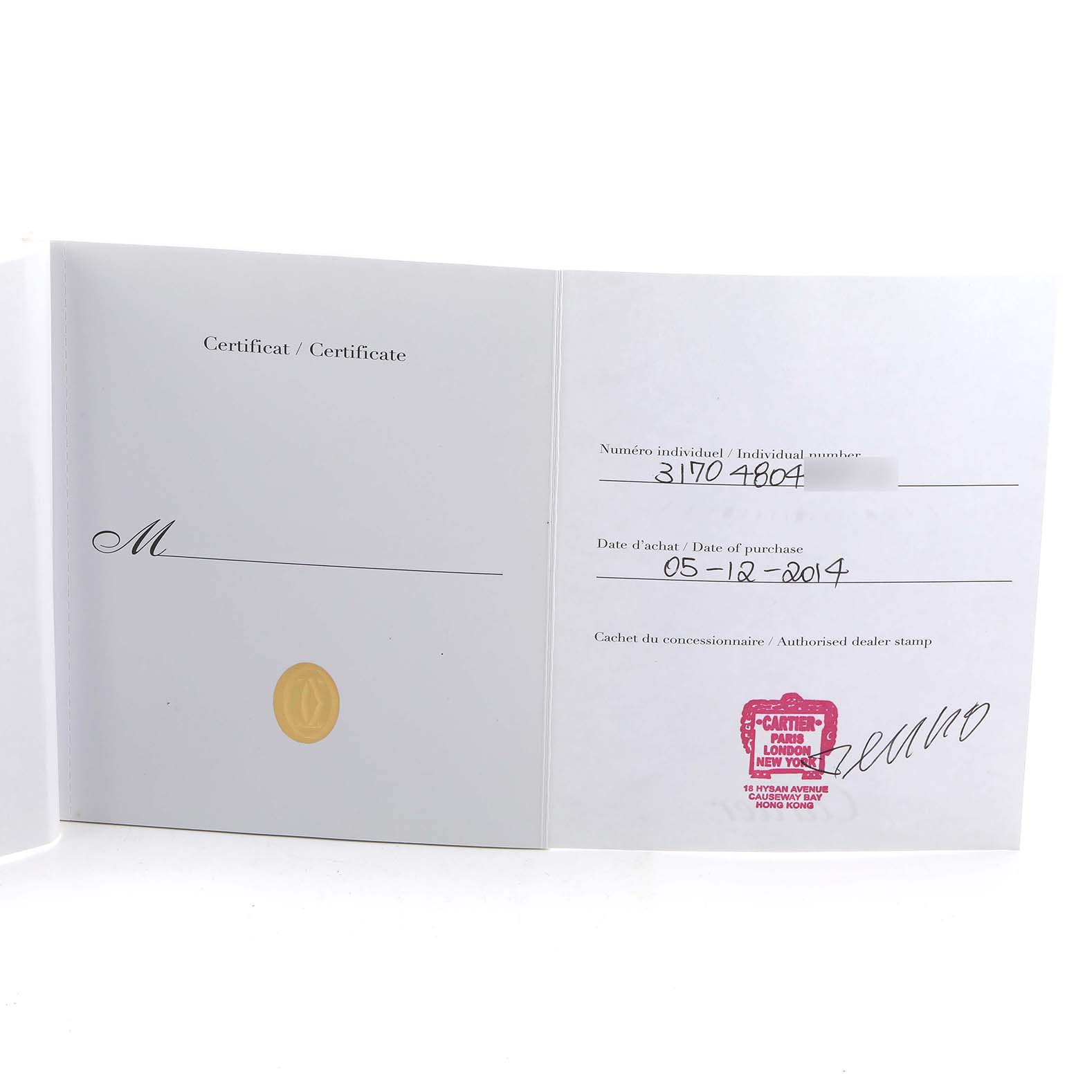 The image shows an open warranty certificate for a Cartier Tank Solo W5200005 Women's Stainless Steel Silver Dial watch.