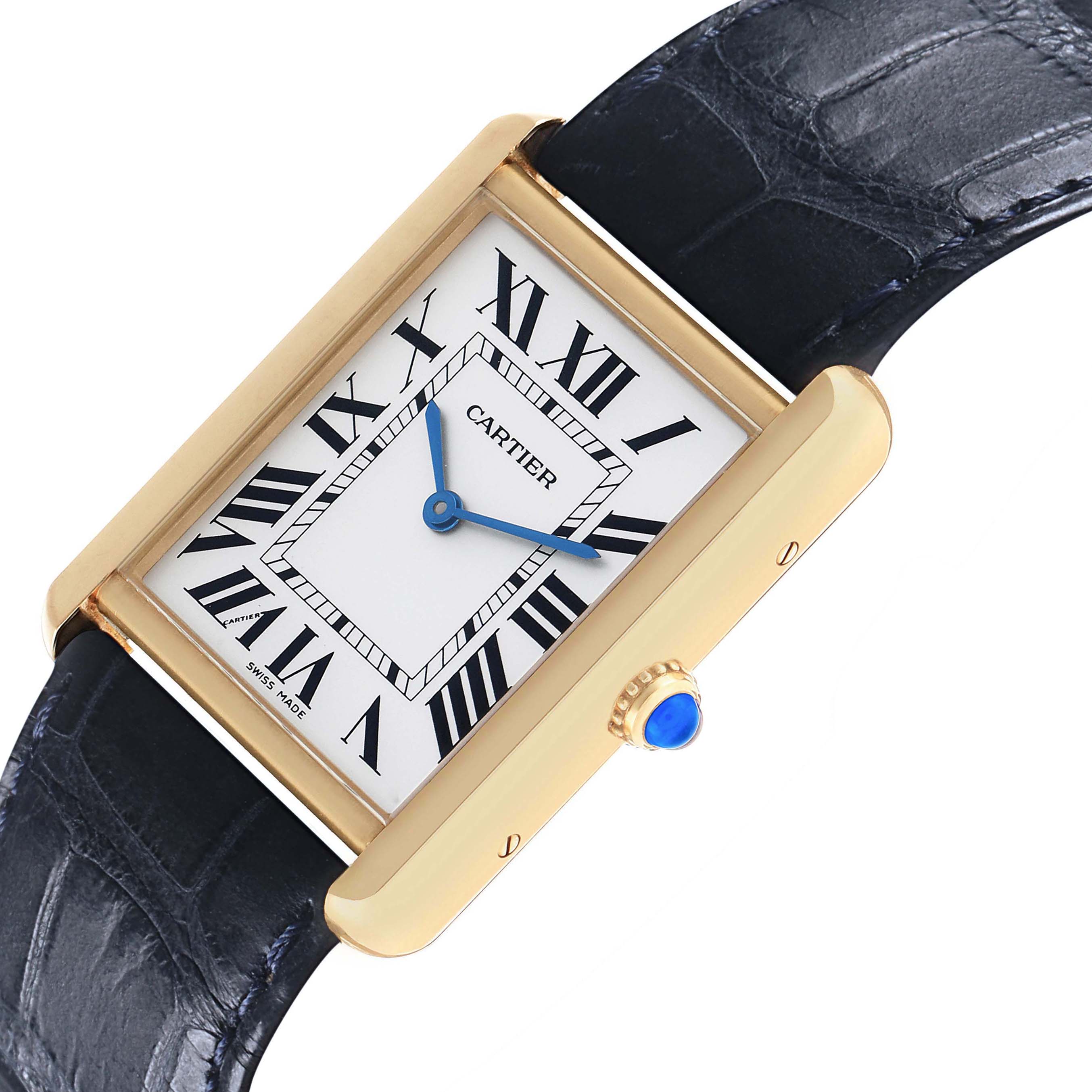 The Cartier Tank Solo W1018855 Men's Yellow Gold Silver Dial watch is shown from an angled side view, including its square face, Roman numerals, blue hands, and leather strap.