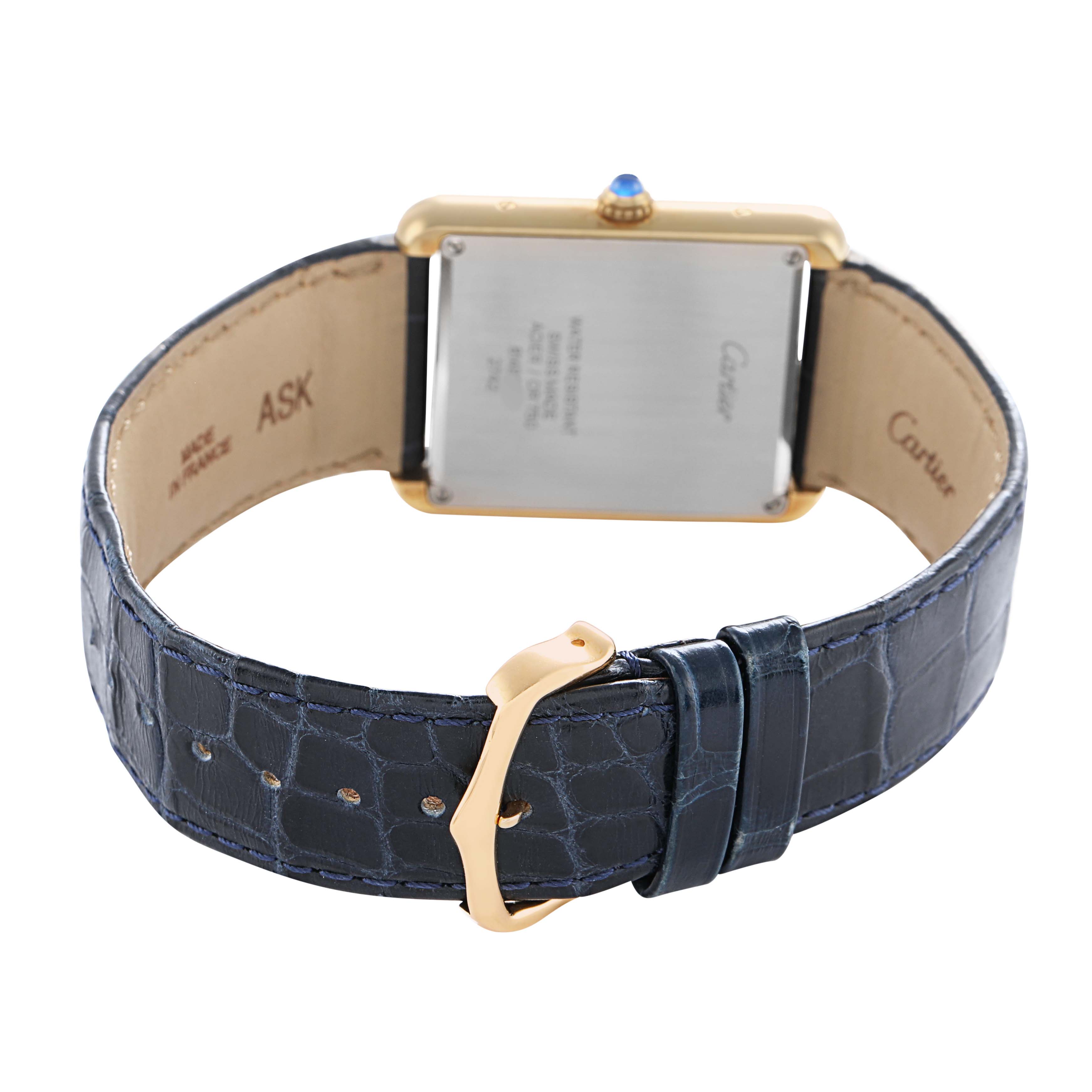 The image shows the back of a Cartier Tank Solo W1018855 Men's Yellow Gold Silver Dial watch, highlighting its blue leather strap and buckle.